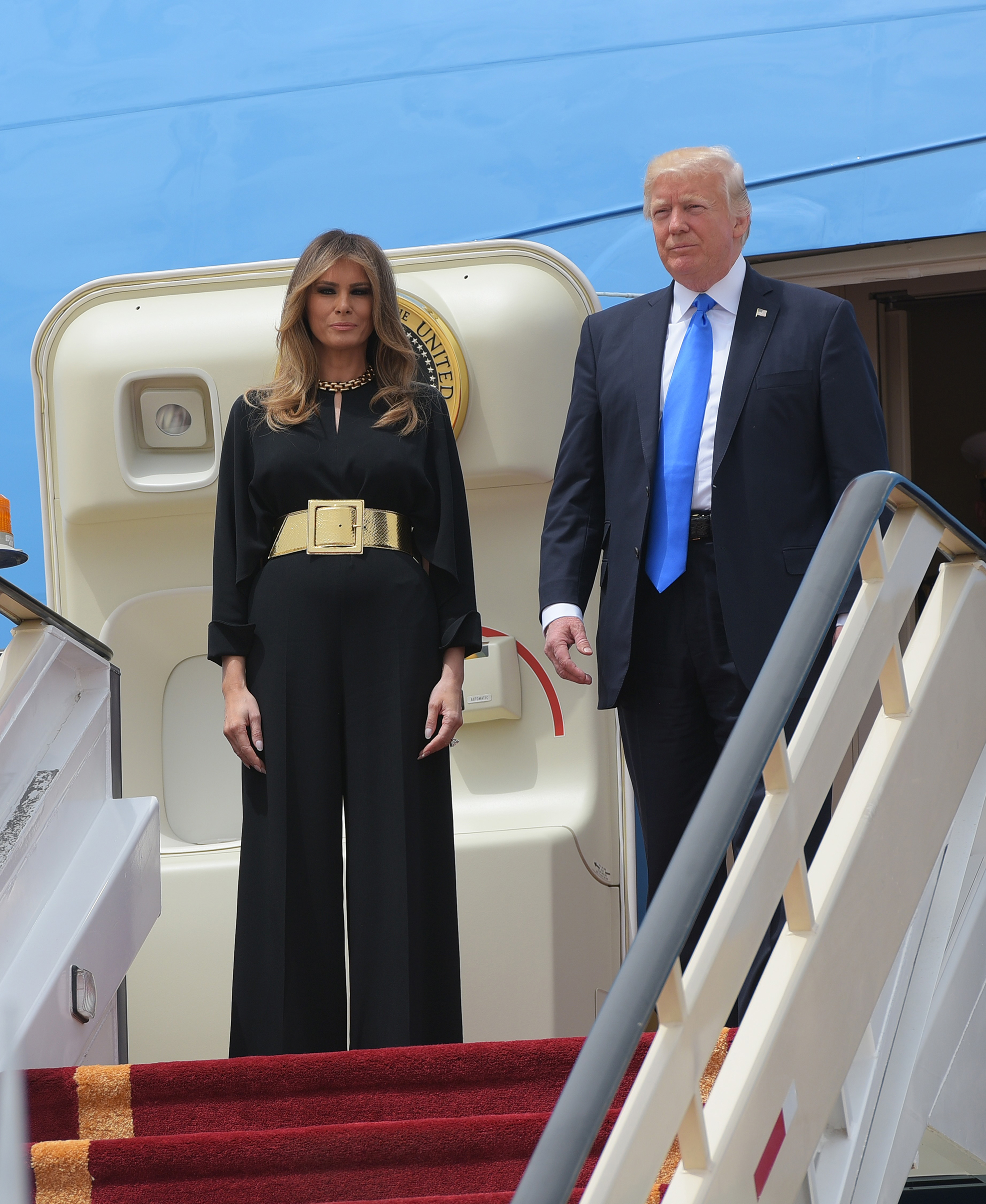 President Donald Trump and First Lady Melania Trump wearing black Stella McCartney jumpsuit and Saint Laurent belt, step off Air Force One upon arrival at King Khalid International Airport in Riyadh on May 20, 2017.