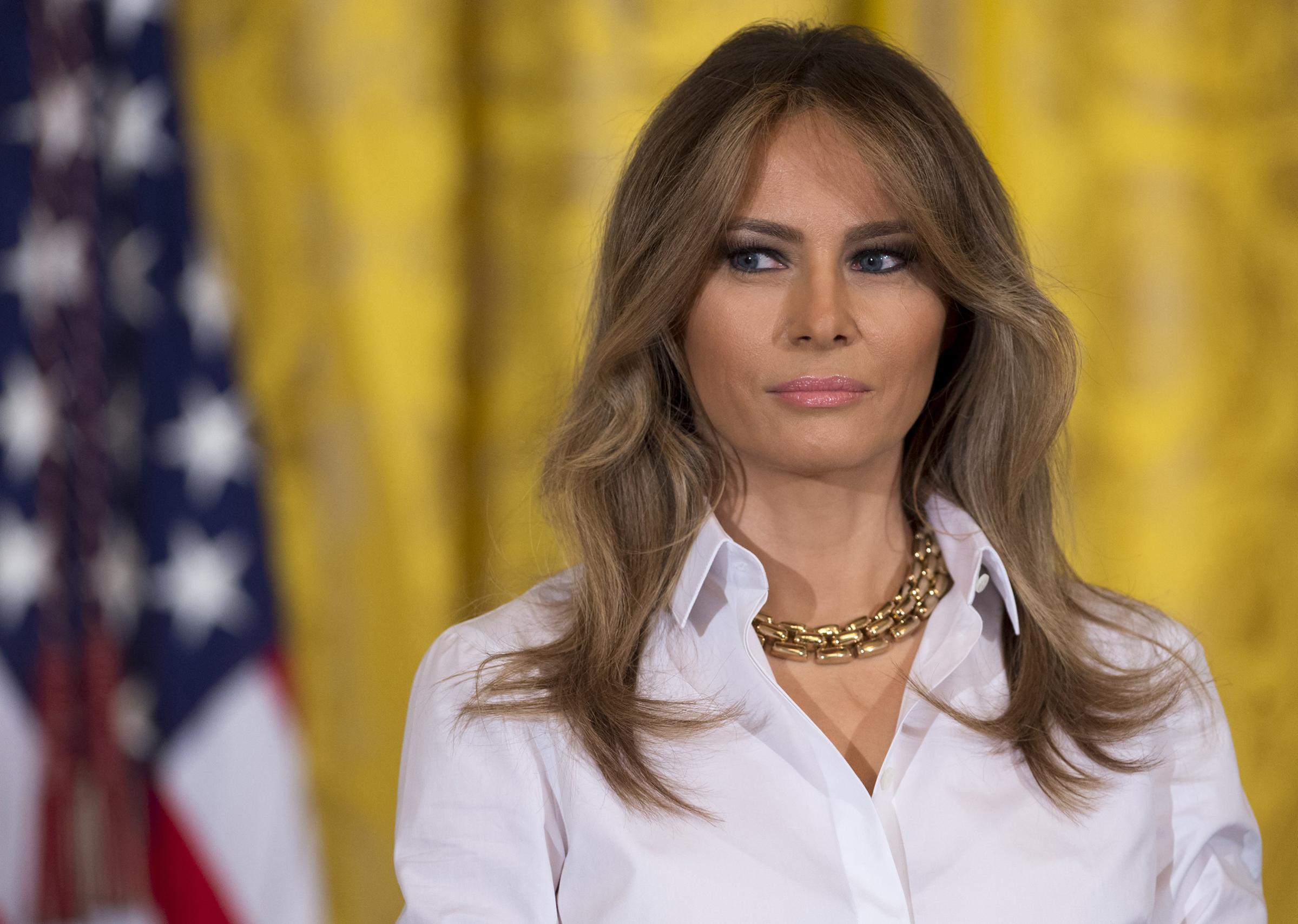 First lady Melania Trump wearing chunky, chain-link gold necklace, speaks during a Mother's Day event for military spouses in the East Room of the White House in Washington, DC, May 12, 2017.