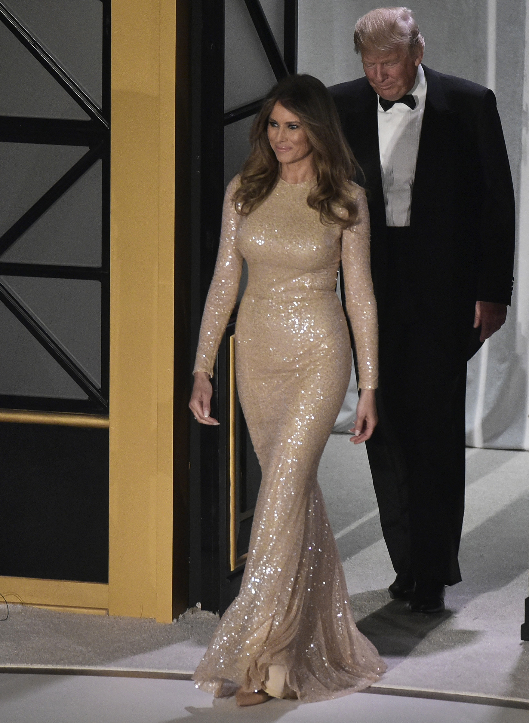President-elect Donald Trump and wife Melania Trump wearing a Reem Acra embellished gown, arrive for a reception and dinner at Union Station in Washington, DC on Jan. 19, 2017.