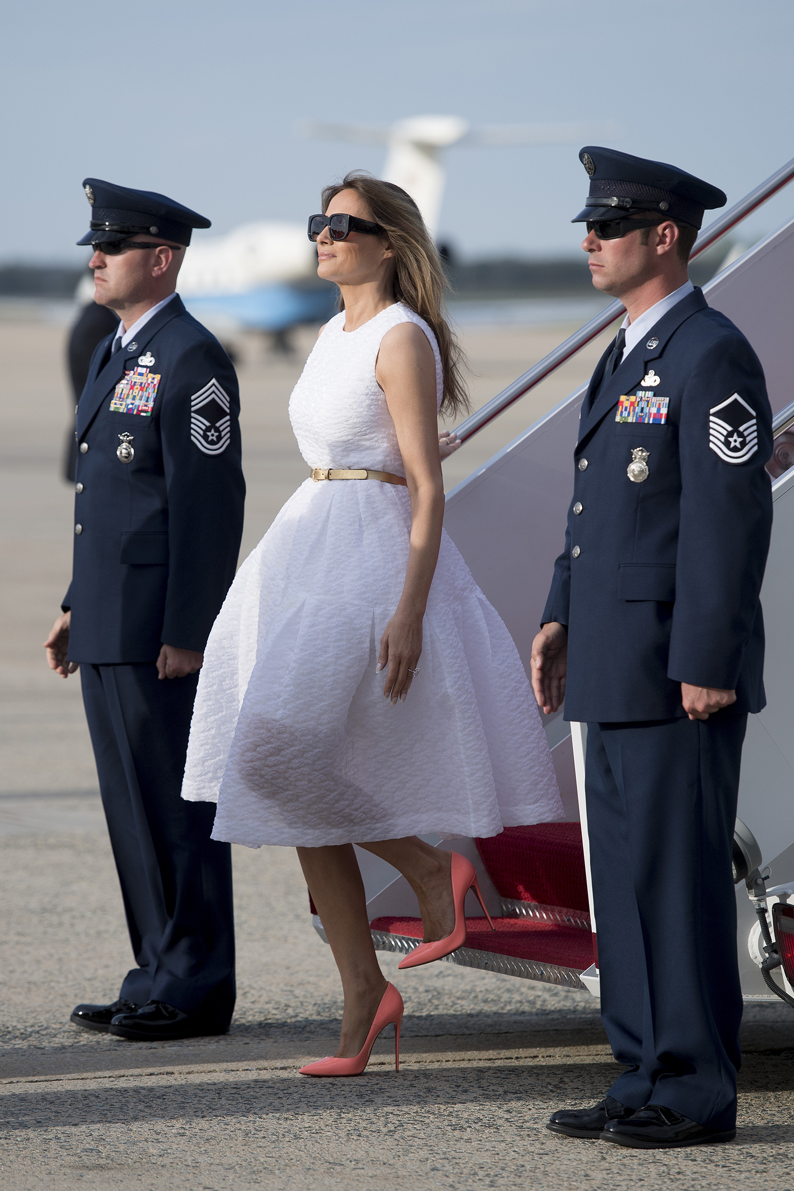 First lady Melania Trump wearing Simone Rocha dress and Christian Louboutin shoes, walks off Air Force One at Andrews Air Force Base, MD, April 16, 2017.