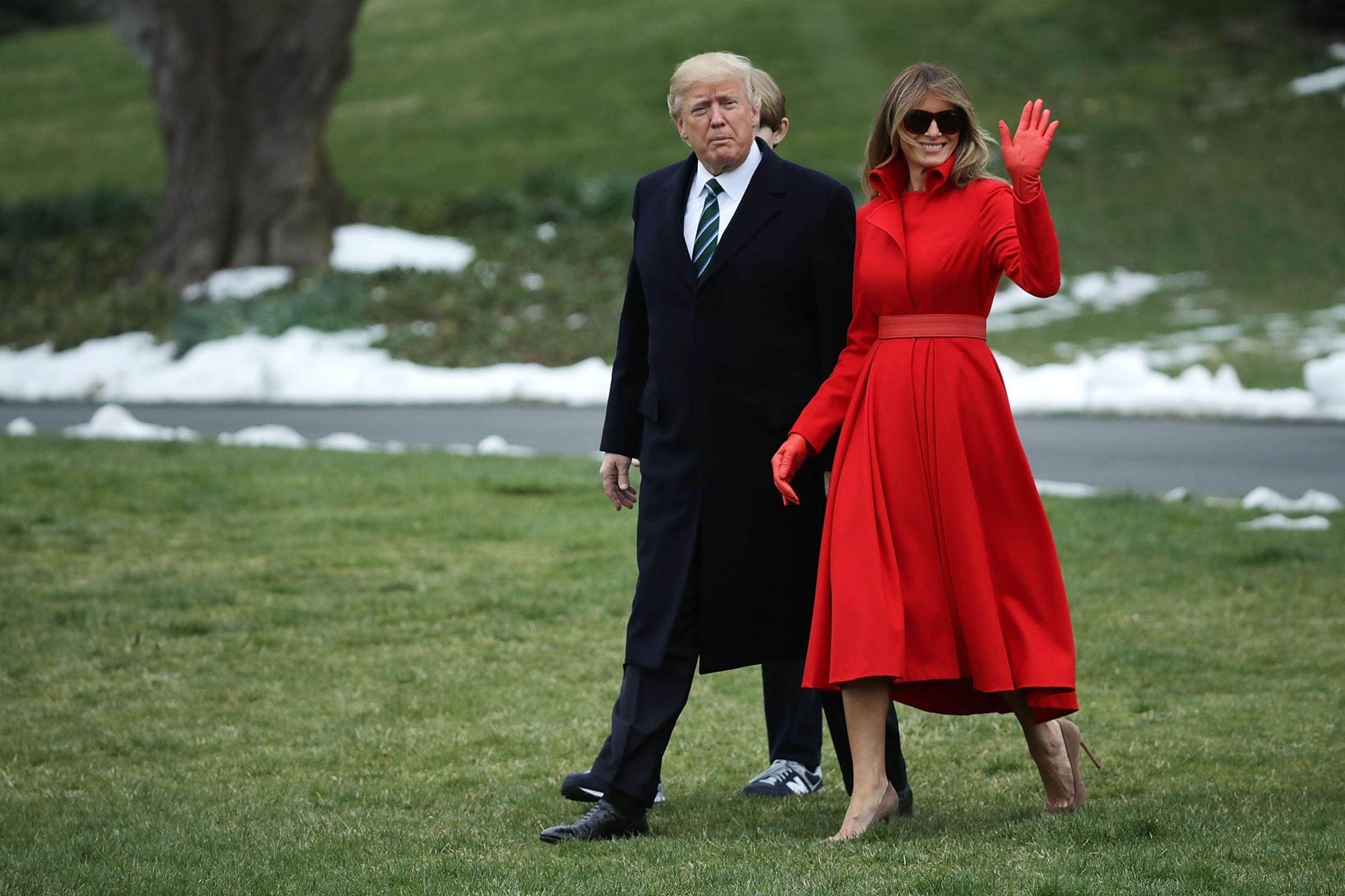 President Donald Trump, first lady Melania Trump wearing a custom made coatdress by designer Alice Roi, and their son Barron Trump depart the White