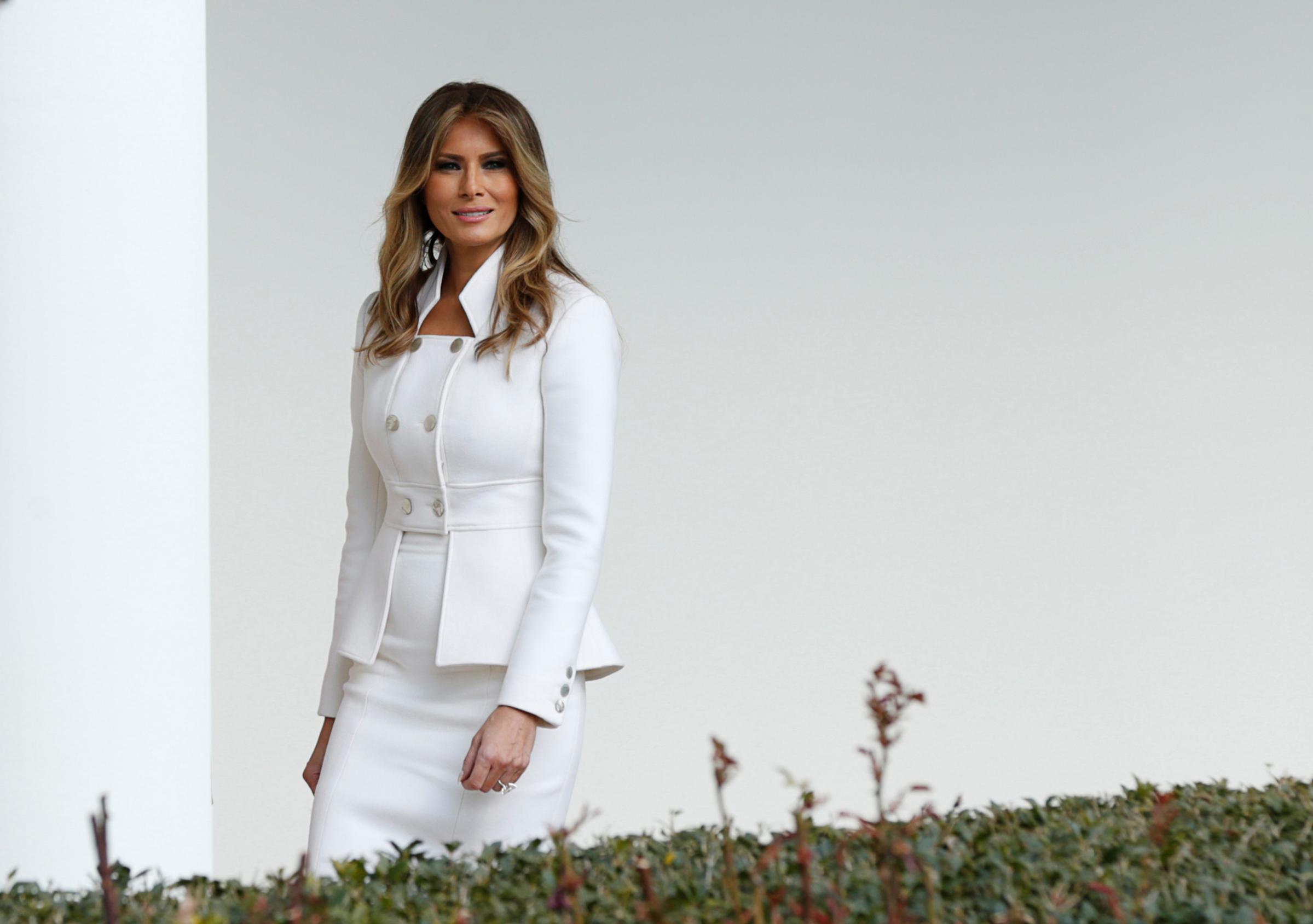 First lady Melania Trump wearing custom Karl lagerfield outfit, walks along the Colonnade at the White House. Feb. 15, 2017.