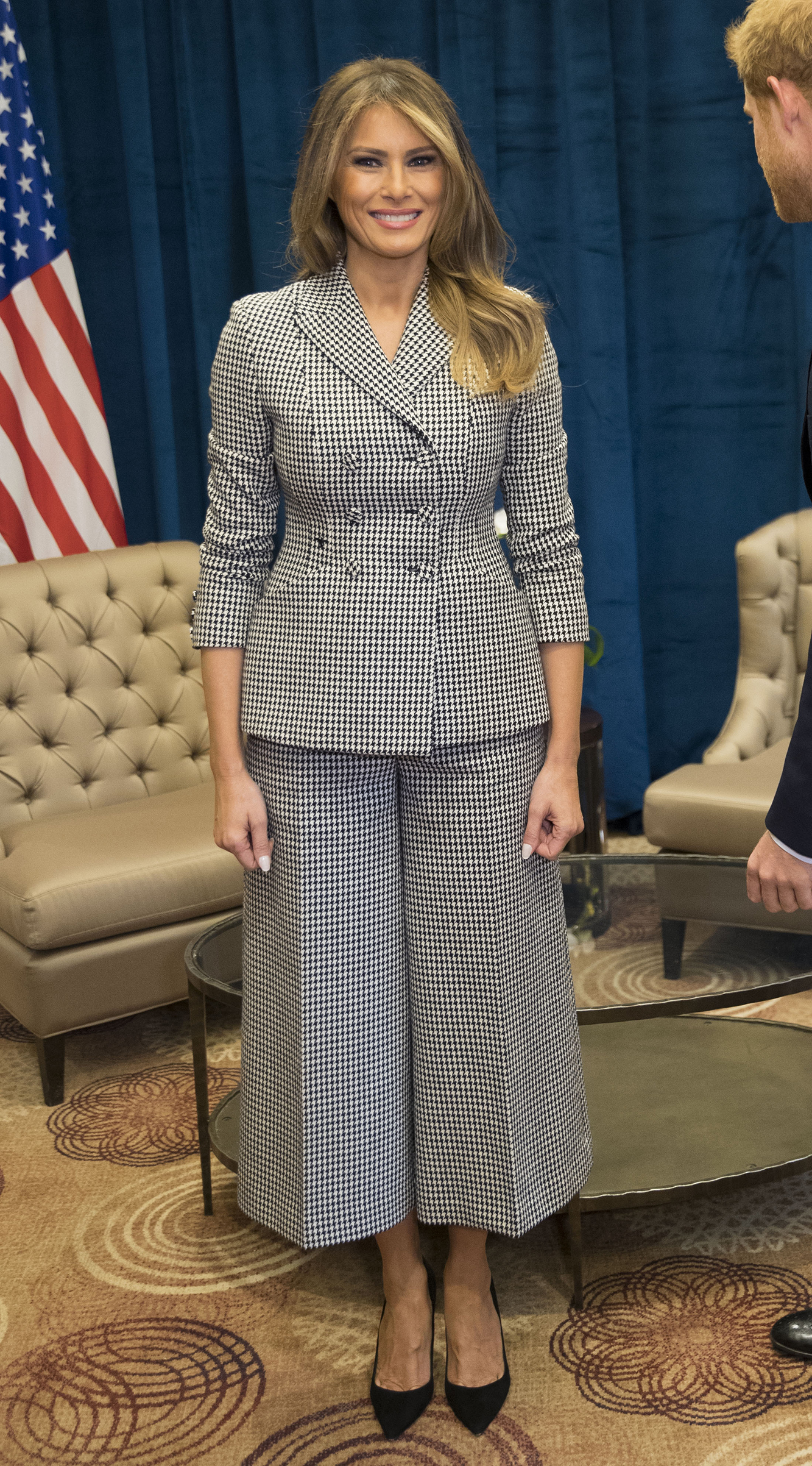 First lady Melania Trump wearing black-and-white checkered culottes suit by Dior,  at a bilateral meeting with Prince Harry on day one of the Invictus Games in Toronto, Canada,
                              Sept. 23, 2017.