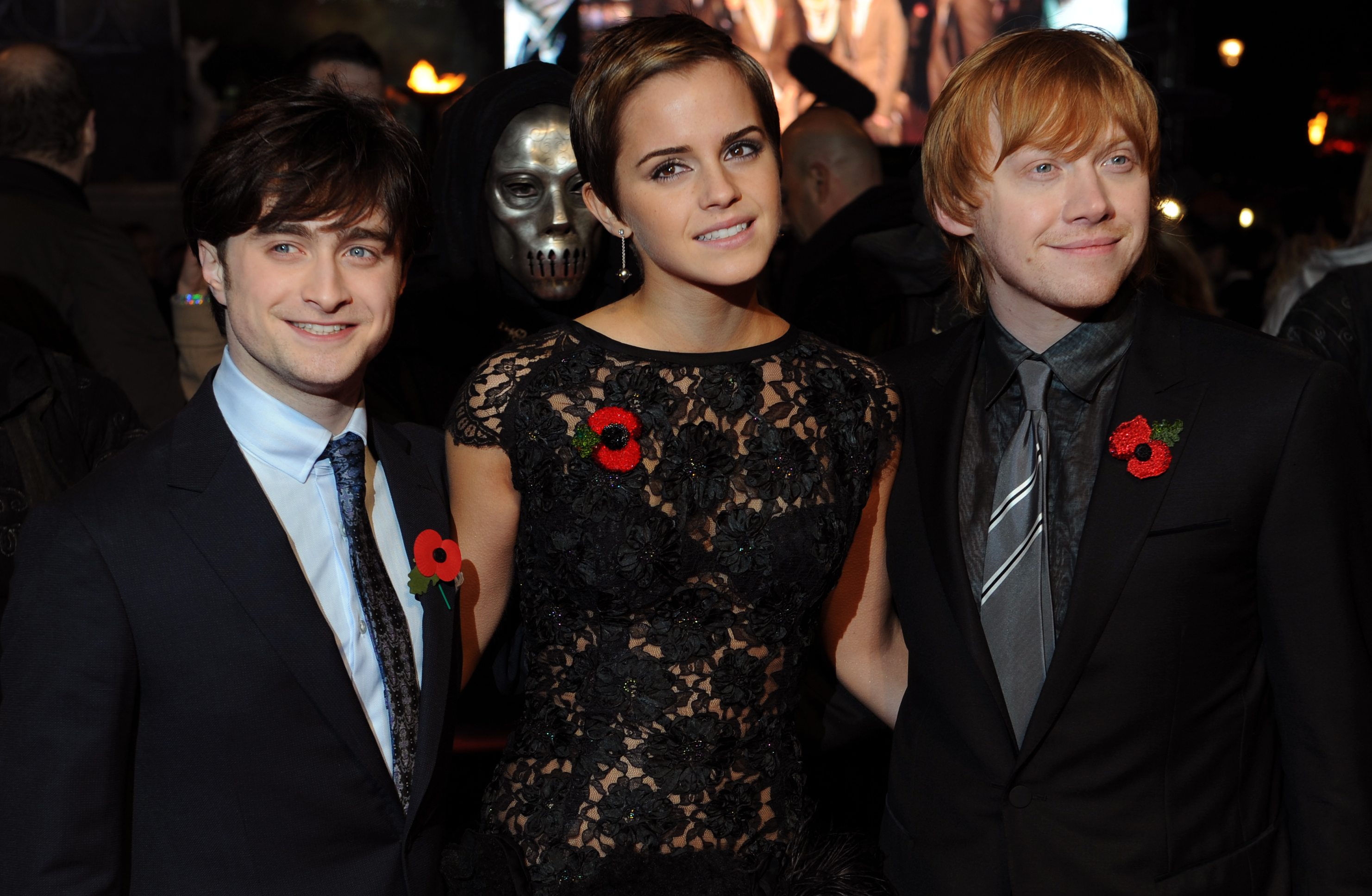 Daniel Radcliffe (L), Emma Watson, (C) and Rupert Grint pose for photographers as they arrive to attend the World Premiere of 'Harry Potter And The Deathly Hallows: Part One' in Leicester Square, central London on November 11, 2010. (BEN STANSALL—AFP/Getty Images)