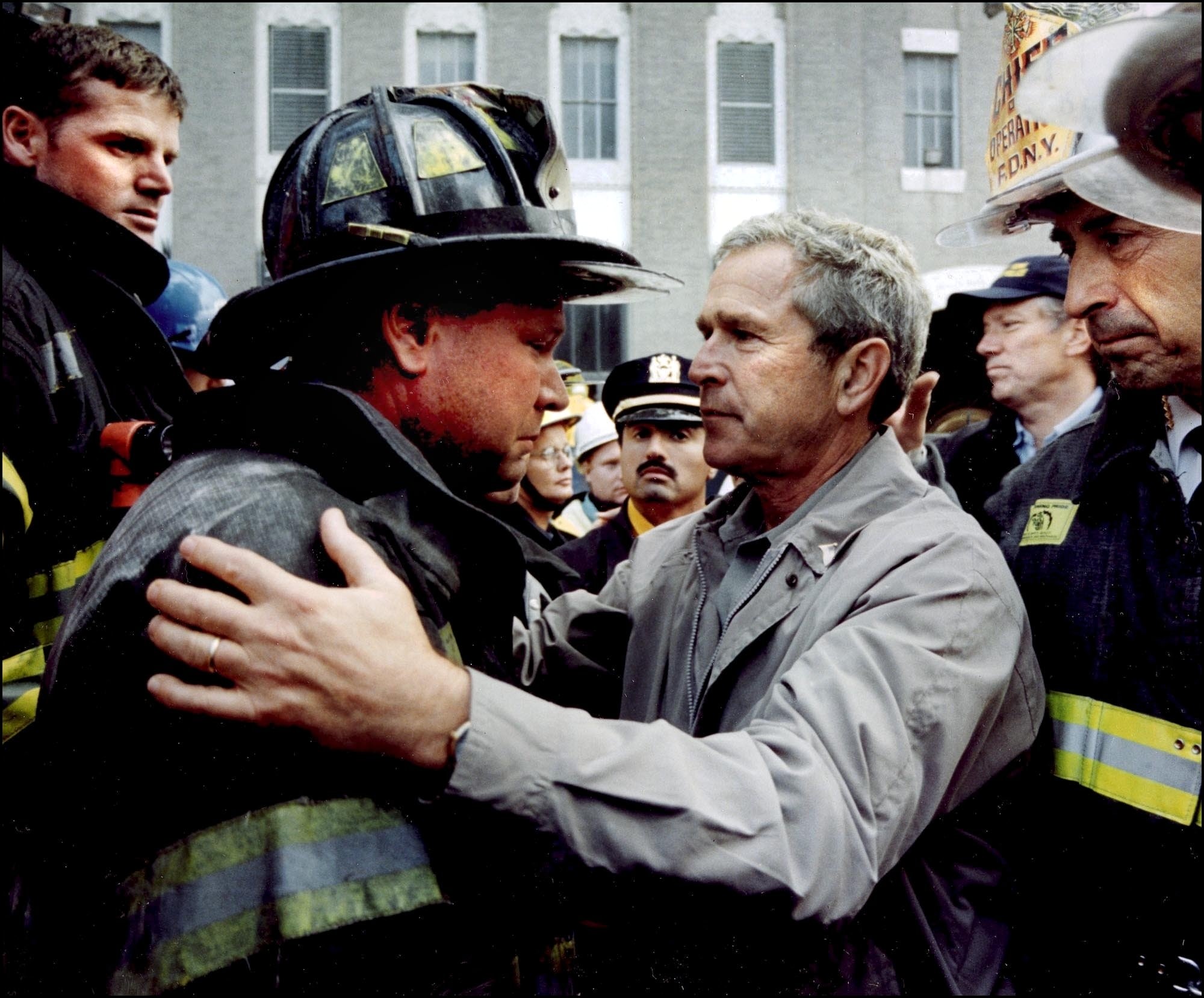On Sept. 14, 2001, in New York City, President George Bush comforts New York City Fire Dept Lt Lenard Phelan of Battalion 46, following the terrorist attacks on the on the World Trade Center. (Gamma-Rapho via Getty Images)