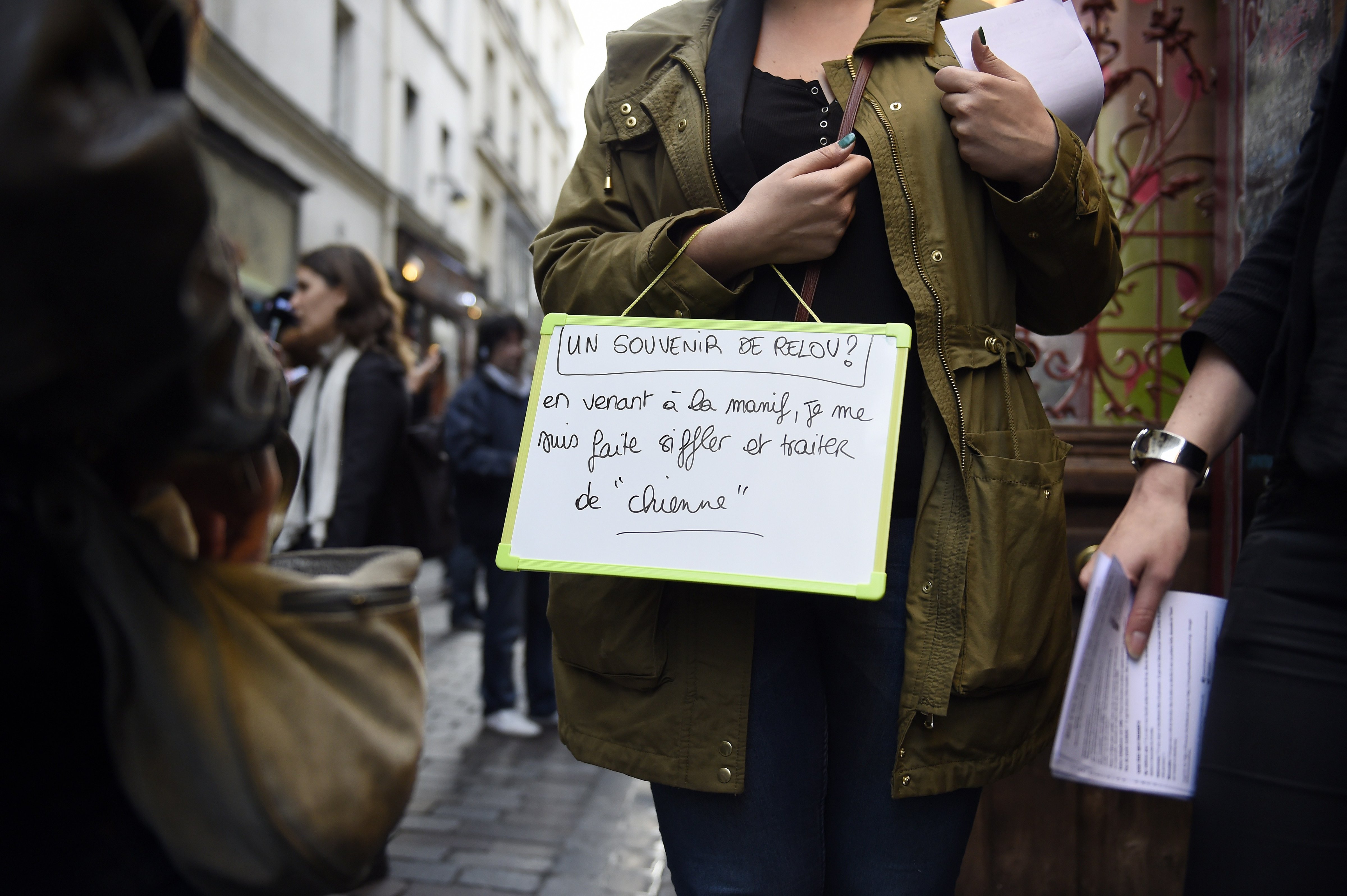 In this file photo, a woman poses with a sign reading "A unhappy memory - as I came to this protest, several people whistled at me and called me a'dog' " as she takes part in a protest against sexual and verbal harassment, on April 25, 2014, in Paris. (Franck Fife—AFP/Getty Images)