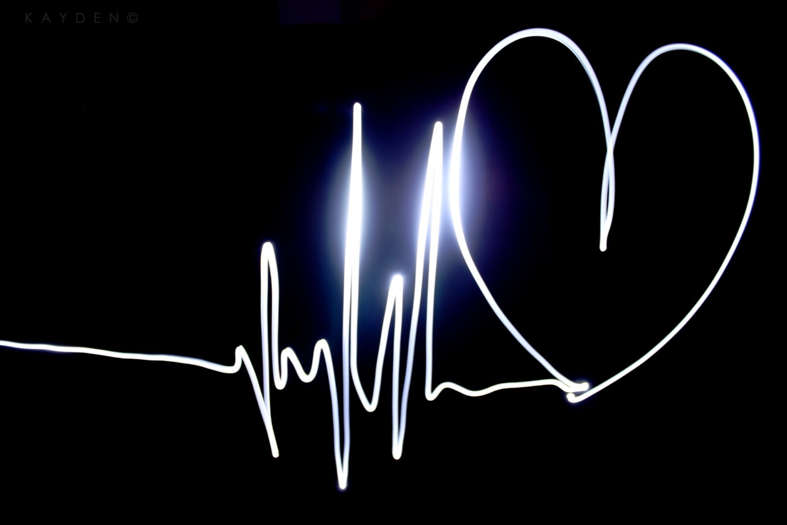 Heart Shape Made From Pulse Trace On Black Background