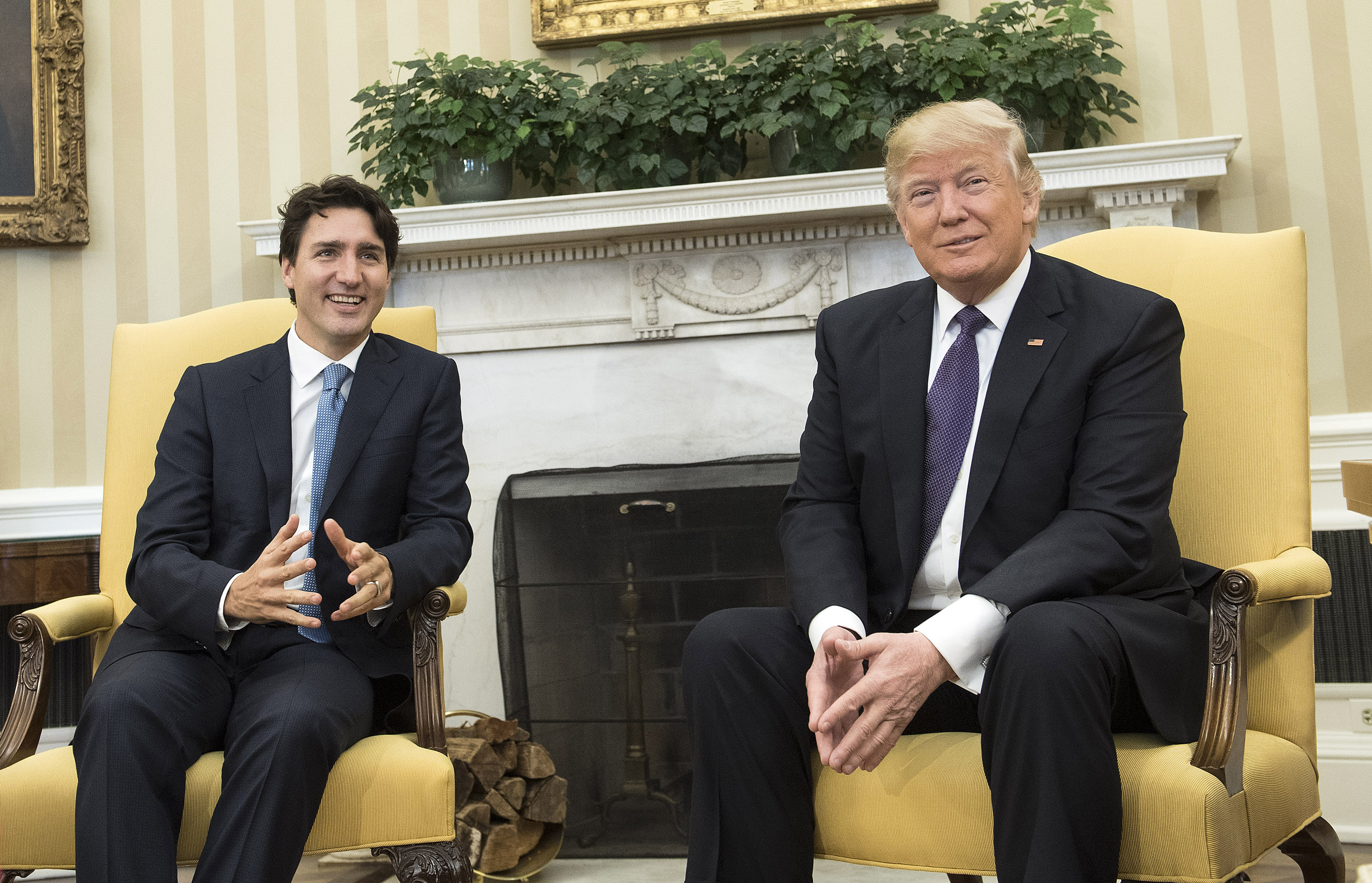U.S. President Donald Trump (R) meets with Prime Minister Justin Trudeau of Canada in the Oval Office at the White House on February 13, 2017 in Washington, D.C. This is the first time the two leaders are meeting at the White House. (Photo by Kevin Dietsch—Pool/Getty)