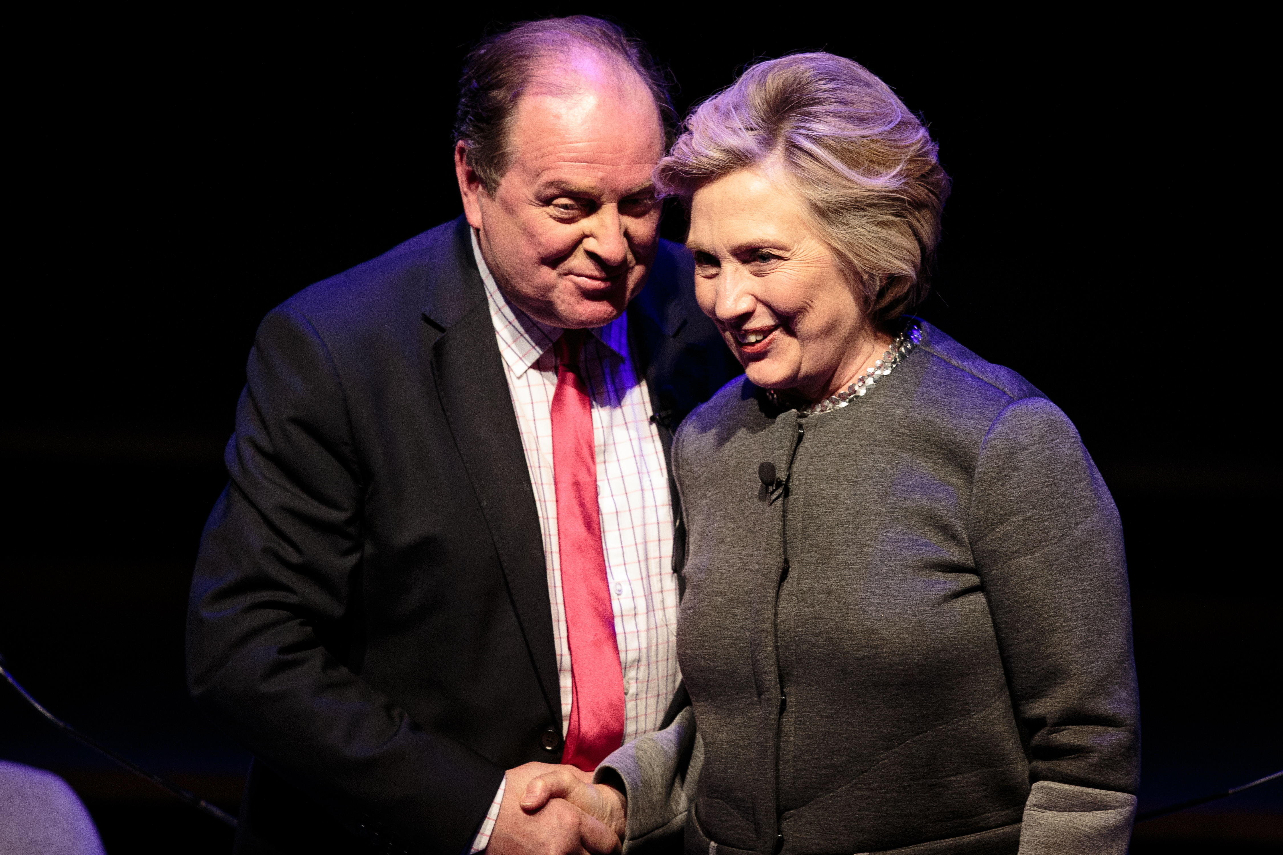 Hilary Clinton (R) shakes hands with broadcaster James Naughtie (L) following her talk at the London Literary Festival at The Royal Festival Hall on October 15, 2017 in London, England. (Jack Taylor—Getty Images)