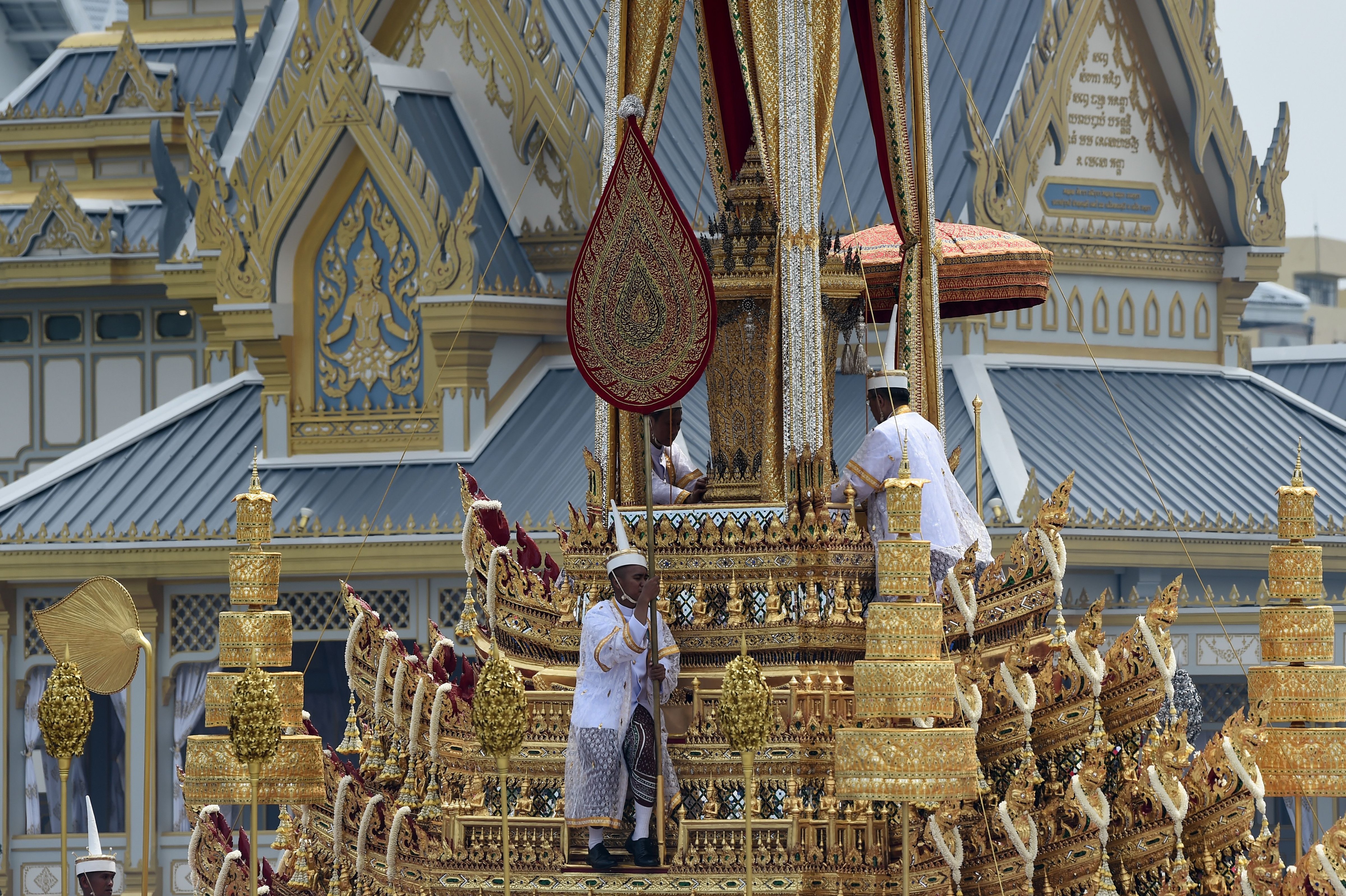 Thai royal doctors take part in the funeral procession for the late Thai king Bhumibol Adulyadej in Bangkok on Oct. 26, 2017. (Lillian Suwanrumpha—AFP/Getty Images)