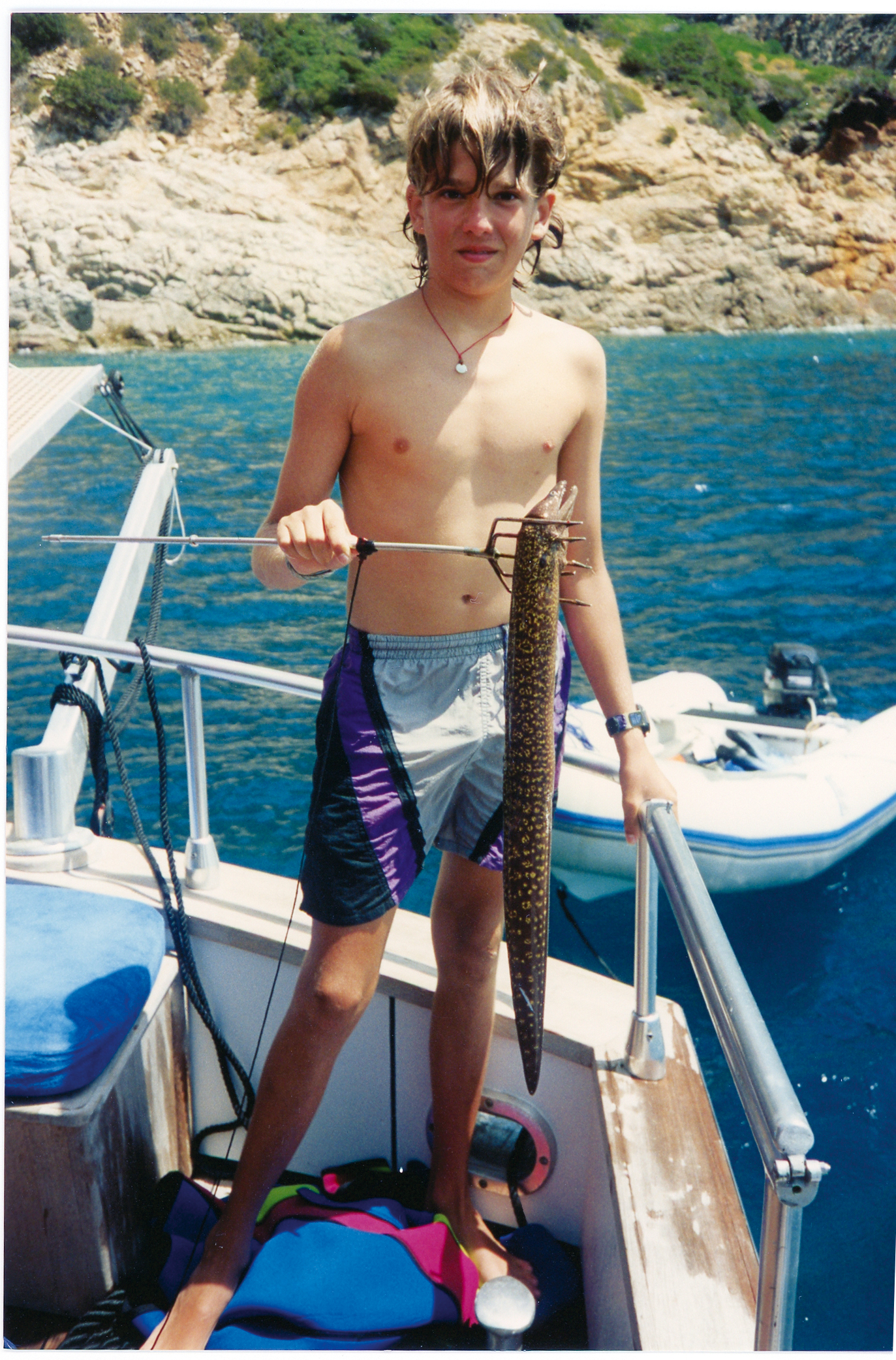 Eel for dinner, again? Don Jr. doesn't look
                              too happy about it. Summer in Greece,
                              1993.