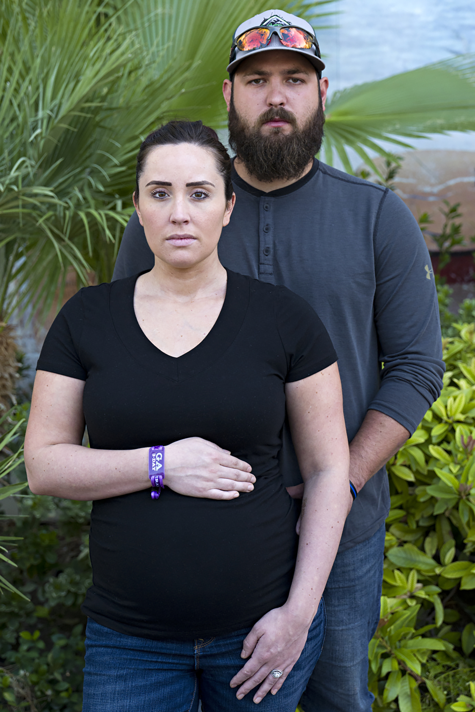 Survivors of the mass shooting, Kelsey Clark eight-months pregnant poses for a portrait with her husband Toby Clark, Las Vegas, Oct. 3, 2017.