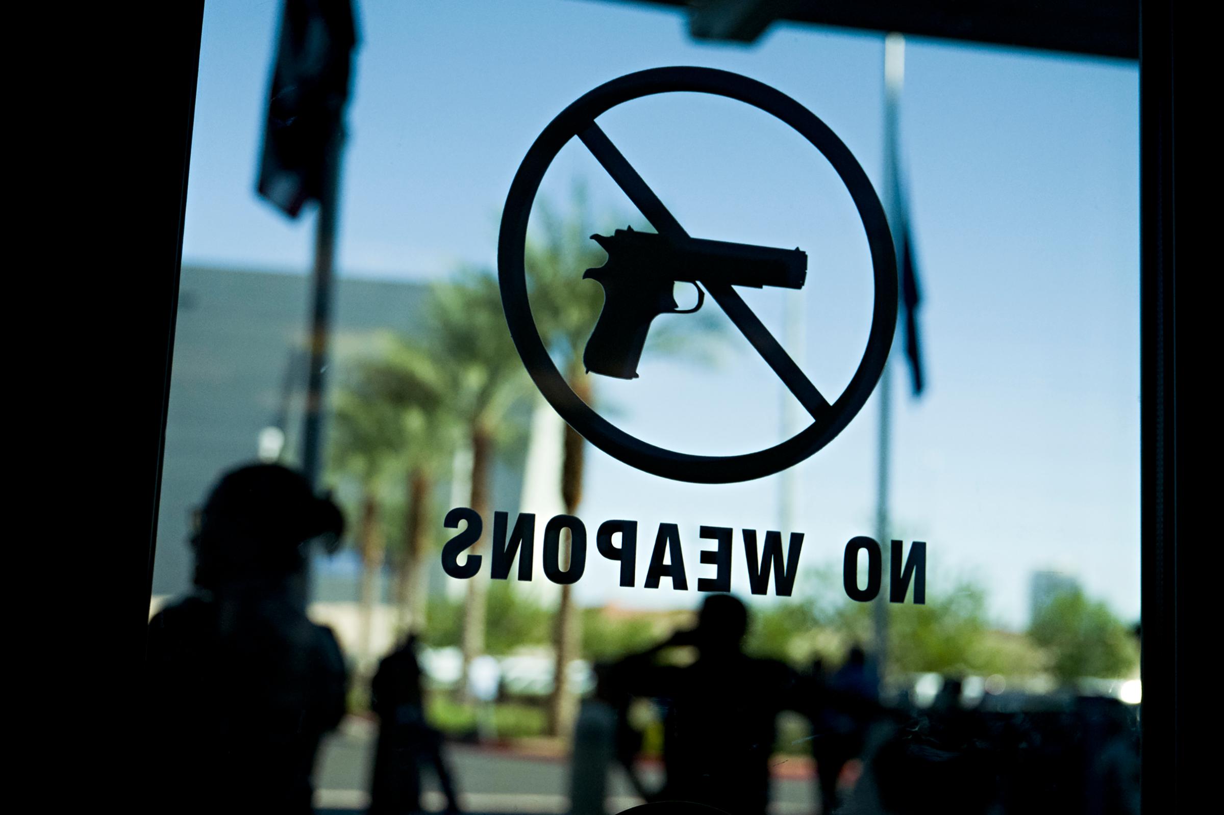 A "no Weapons" sign on a door of the Las Vegas Metropolitan Police Department headquarters.