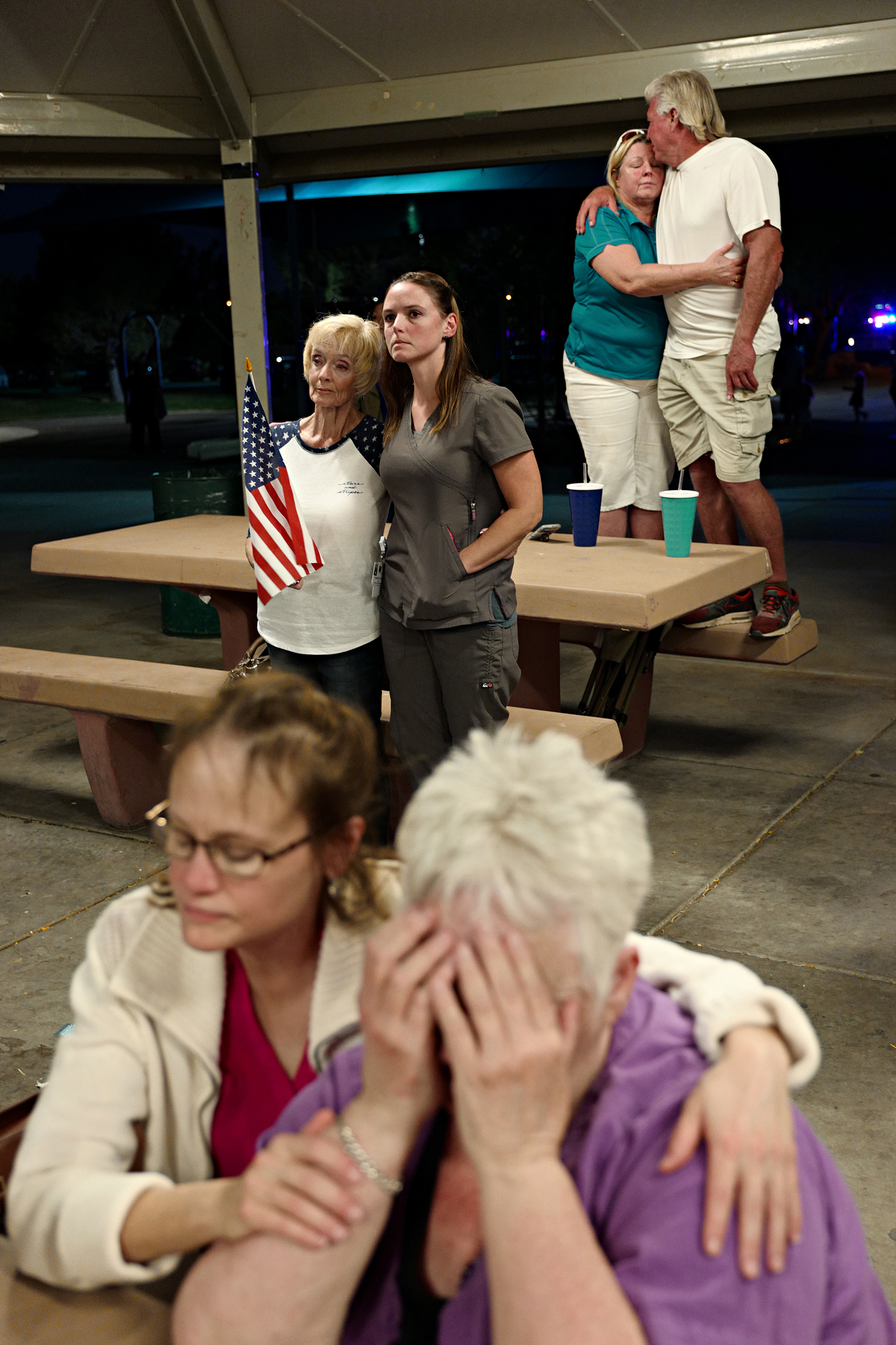 A prayer vigil held at Mountain Crest Park for the victims of Sunday night's shooting on October 3, 2017 in Las Vegas, Nevada.Matt Stuart—Magnum for TIMEA prayer vigil held at Mountain Crest Park for the victims of Sunday night's shooting on October 3, 2017 in Las Vegas, Nevada. Garth Courtney/ Cindy Cusimano (back row)Connie Lane (Flag)/Celestial Olave and Maxine Jonson/Janetta Gray (Front row)Matt Stuart—Magnum for TIME