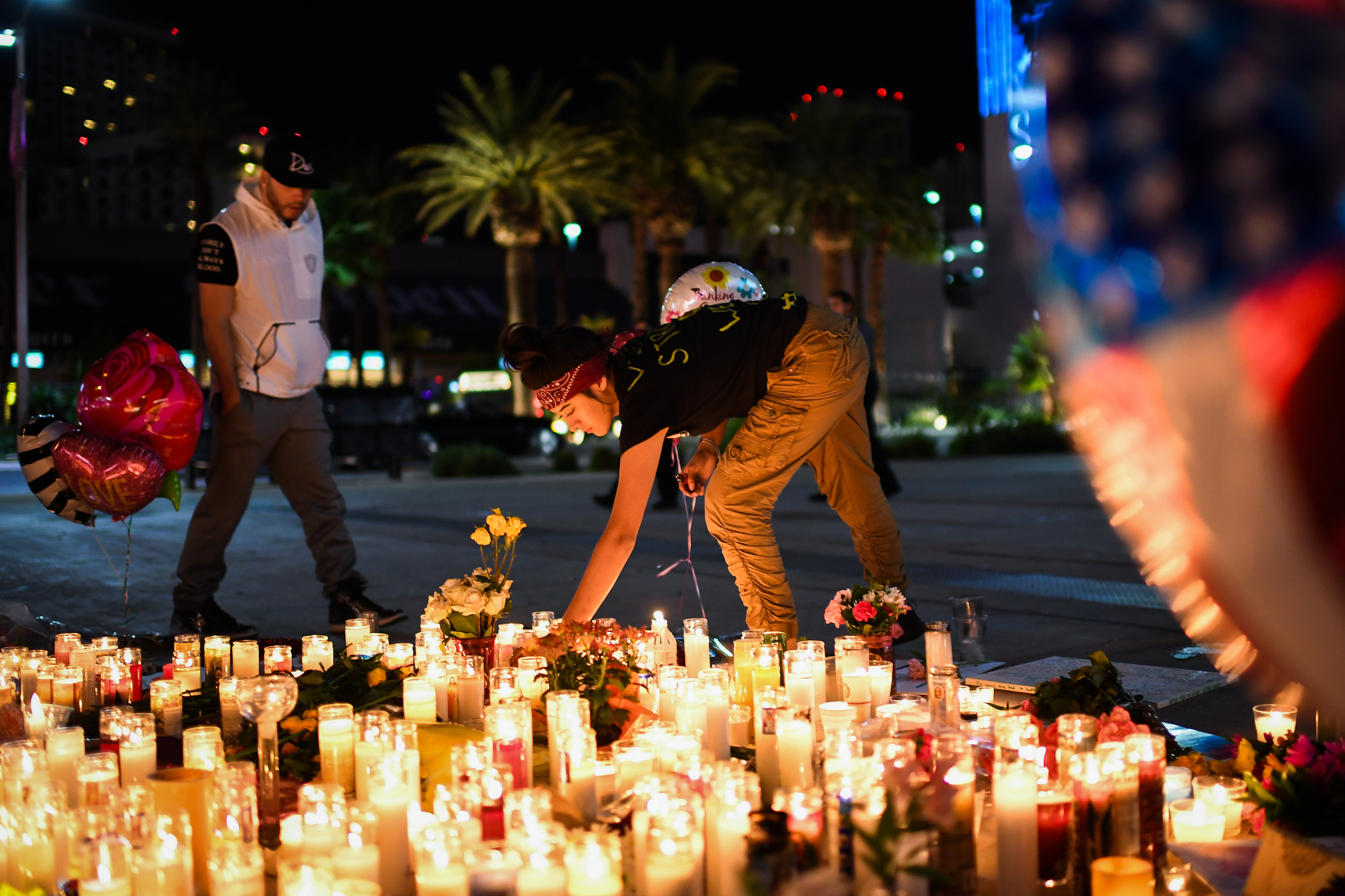 Priscilla Olivas, 19, of Las Vegas, NV, lights up a candle at a street vigil that was held for the victims along the Las Vegas Strip a day after 59 people were killed and more than 500 wounded at the Route 91 Harvest Country Music Festival on Monday, October 2, 2017, in Las Vegas, NV. (Salwan Georges&mdash;The Washington Post/Getty Images)
