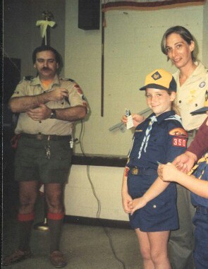 A young Margo Mankes, in Cub Scouts uniform, with her parents (Courtesy Margot Goldstein)