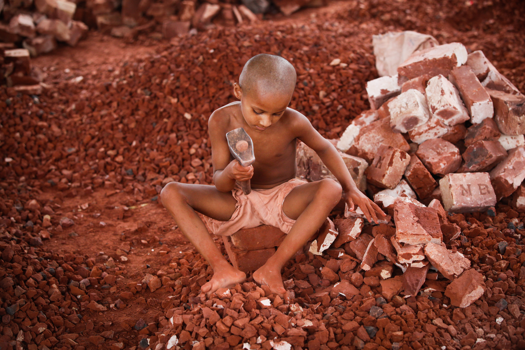 Bangladeshi Child labor break bricks