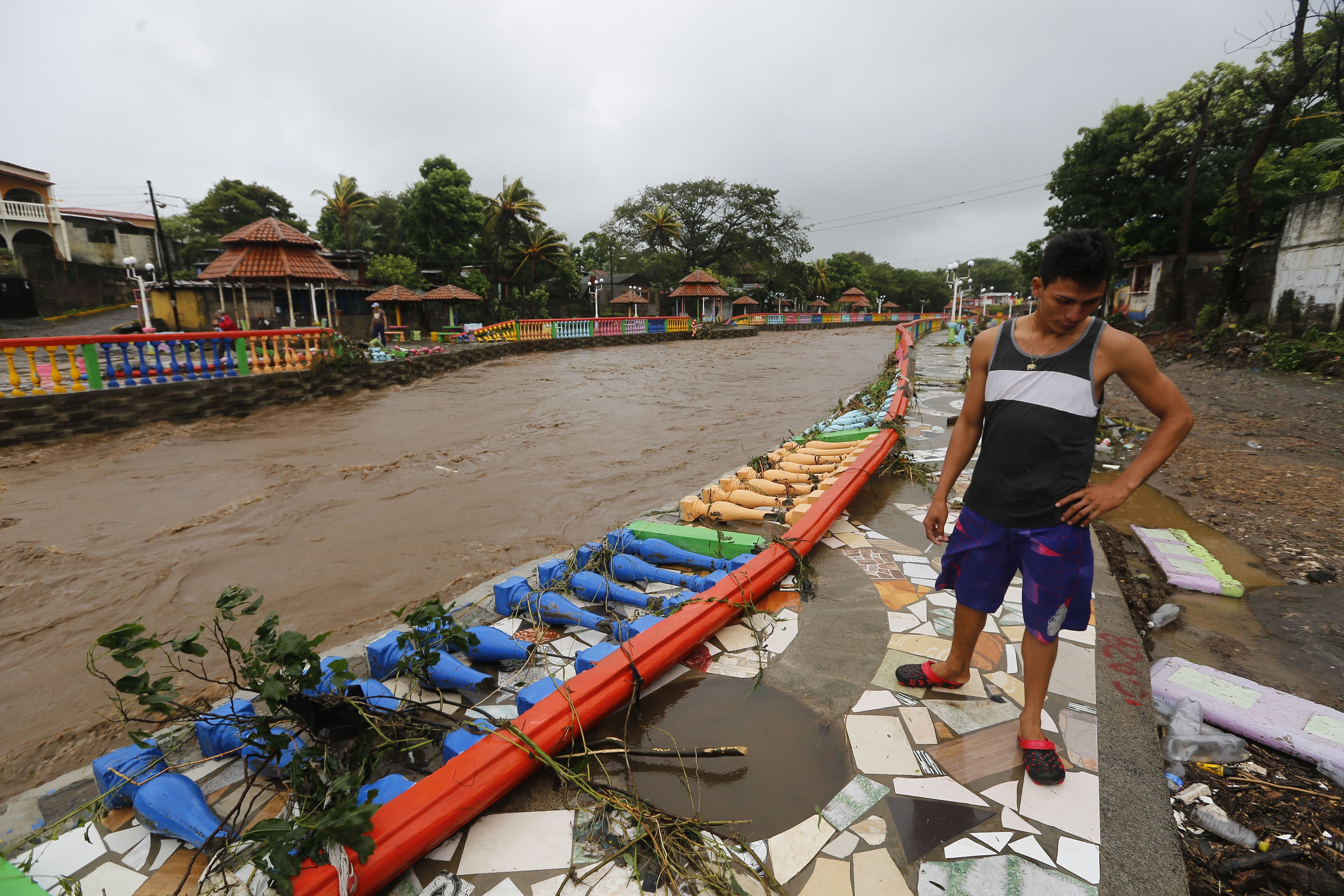A resident looks at damages caused by the overflowing of the Masachapa River following the passage of Tropical Storm Nate in the city of Masachapa, Nicaragua on October 5, 2017. (INTI OCON—AFP/Getty Images)