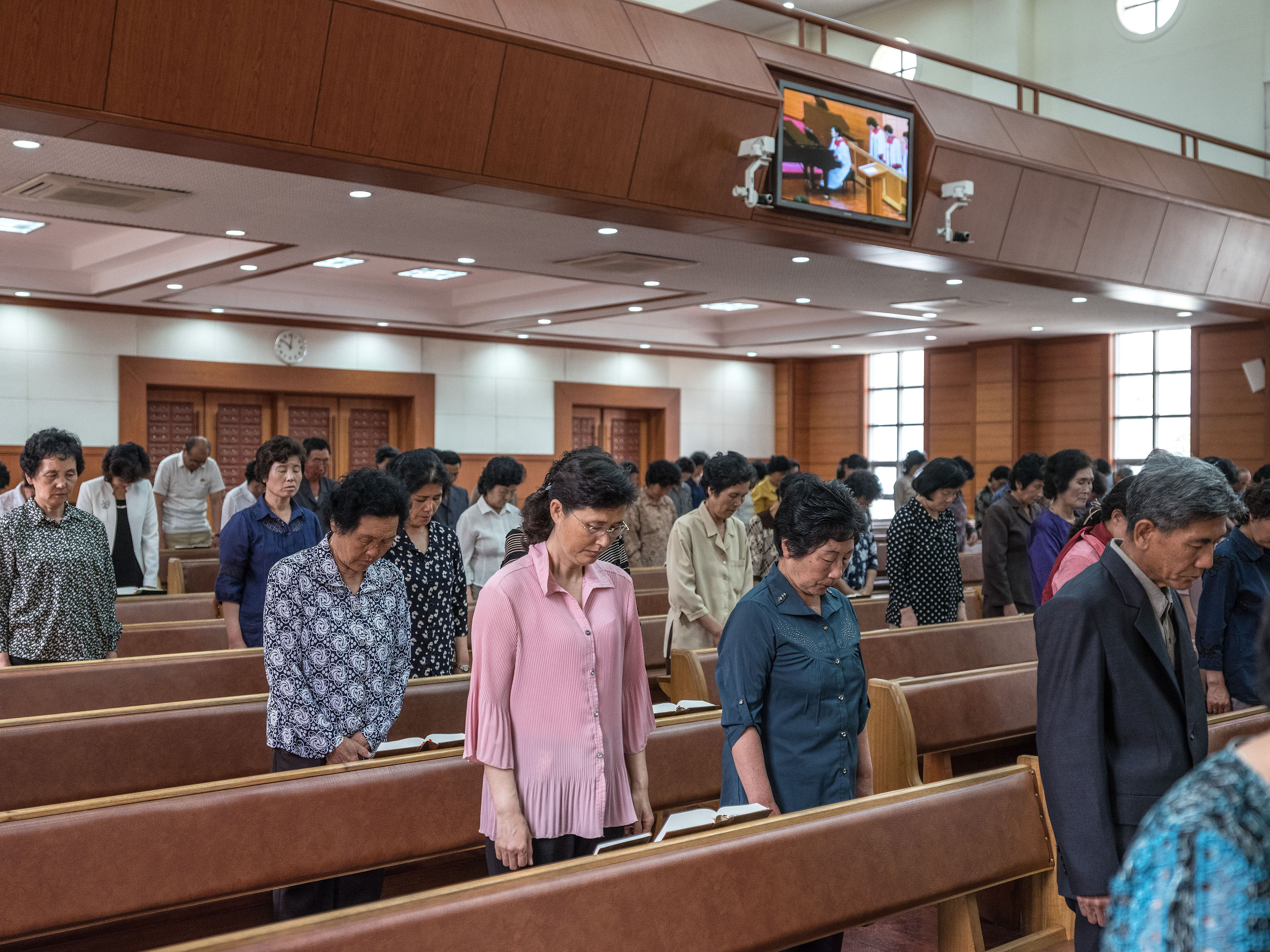 Worshipers pray at Bongsu Church in Pyongyang. (Carl De Keyzer—Magnum Photos)