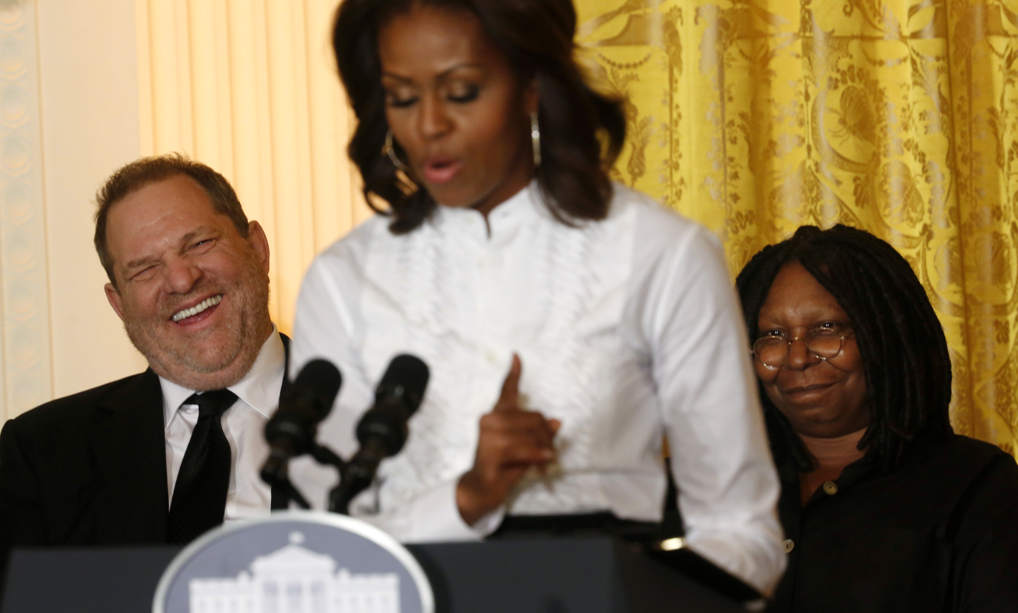 Film producer Weinstein laughs at remarks directed at him by U.S. first lady Michelle Obama as she hosts a workshop at the White House for high school students about careers in film in Washington