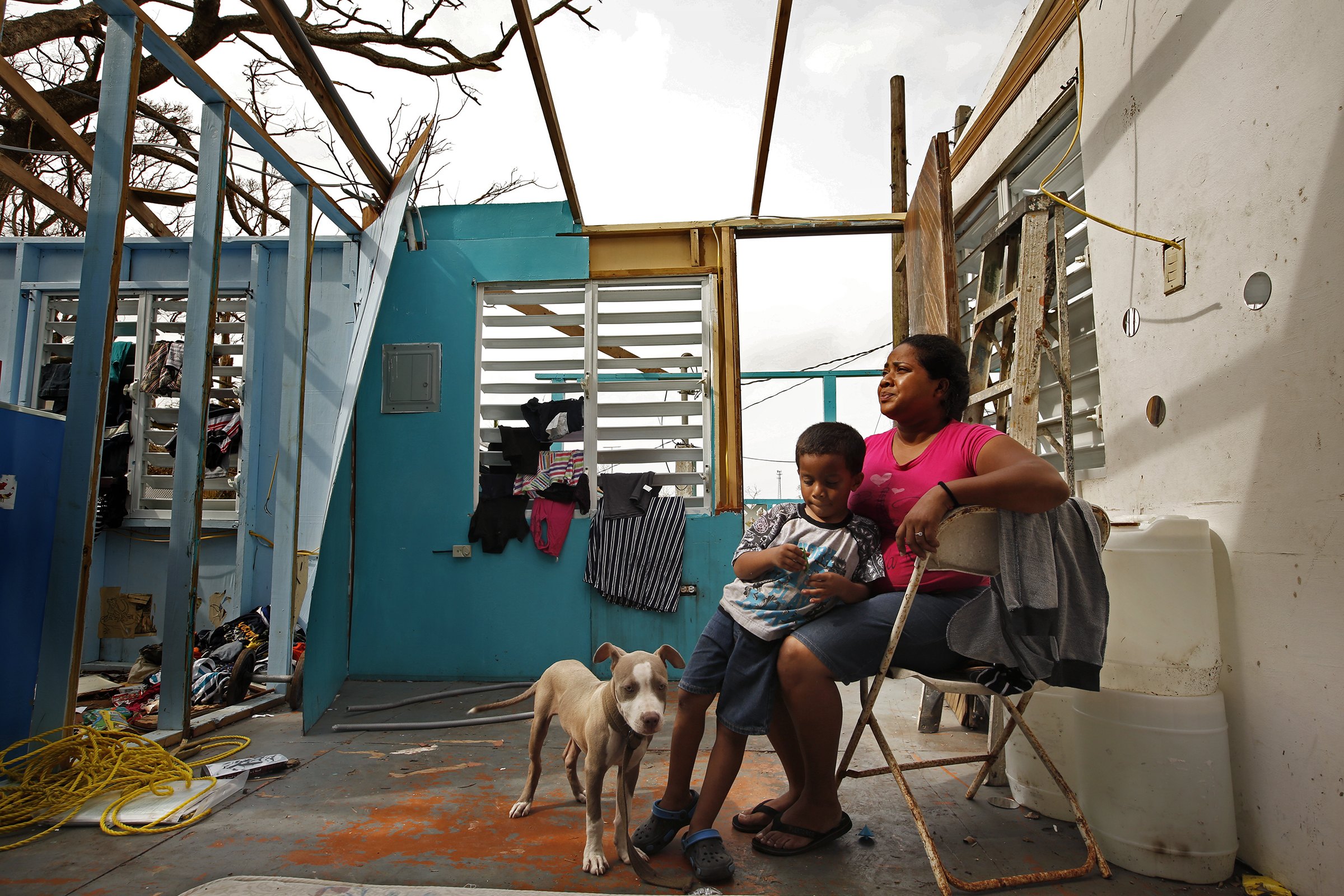 Heydee Perez, age 29, and her son, Yenel Calera, age 4 have not received any aid one week after Hurricane Maria. The roof of their home is gone and they have very little to eat. (Carolyn Cole—LA Times/Getty Images)