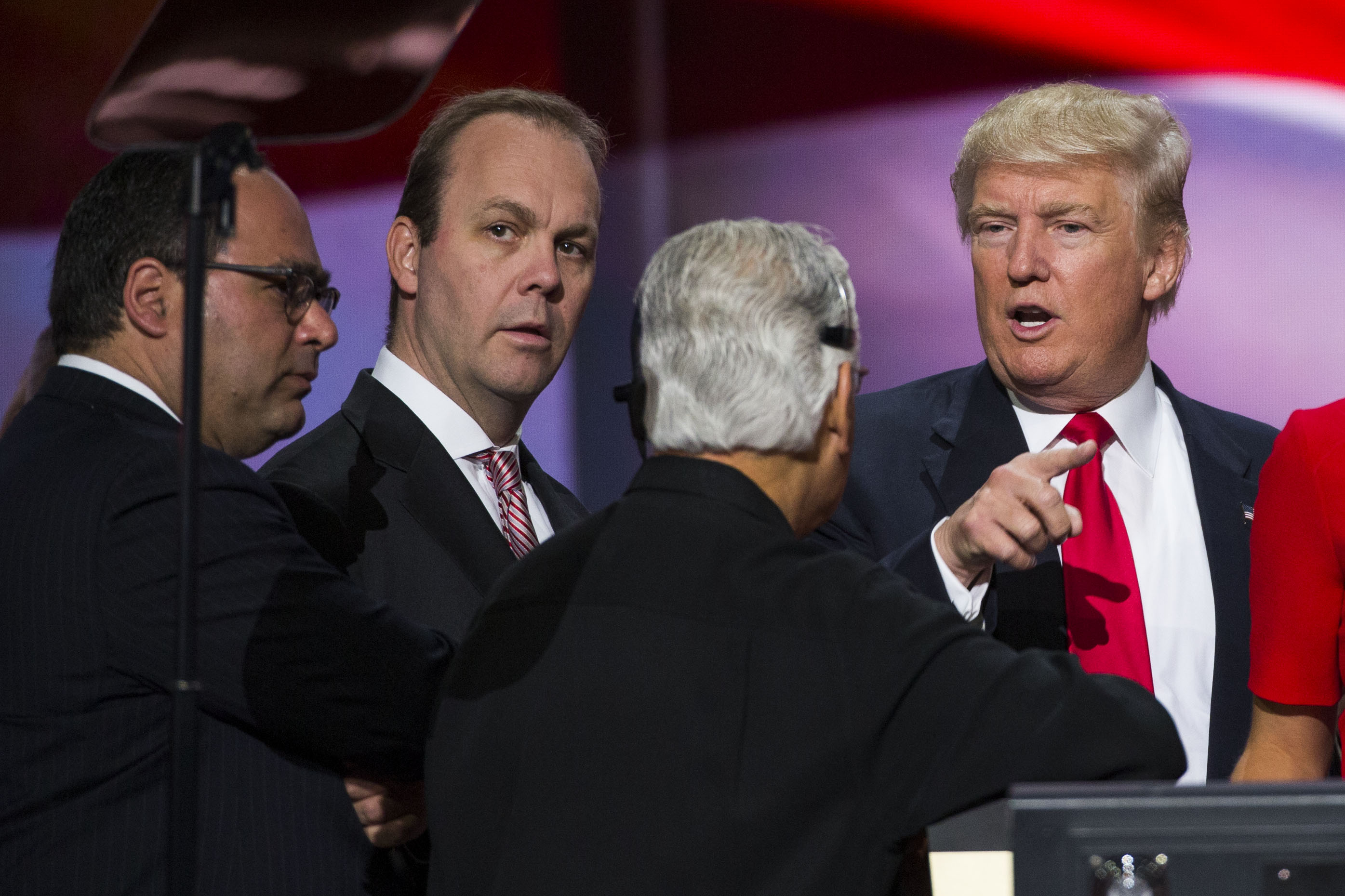 Republican nominee Donald Trump speaks with Rick Gates at the Republican Convention, July 21, 2016 at the Quicken Loans Arena in Cleveland. (Brooks Kraft—Getty Images)
