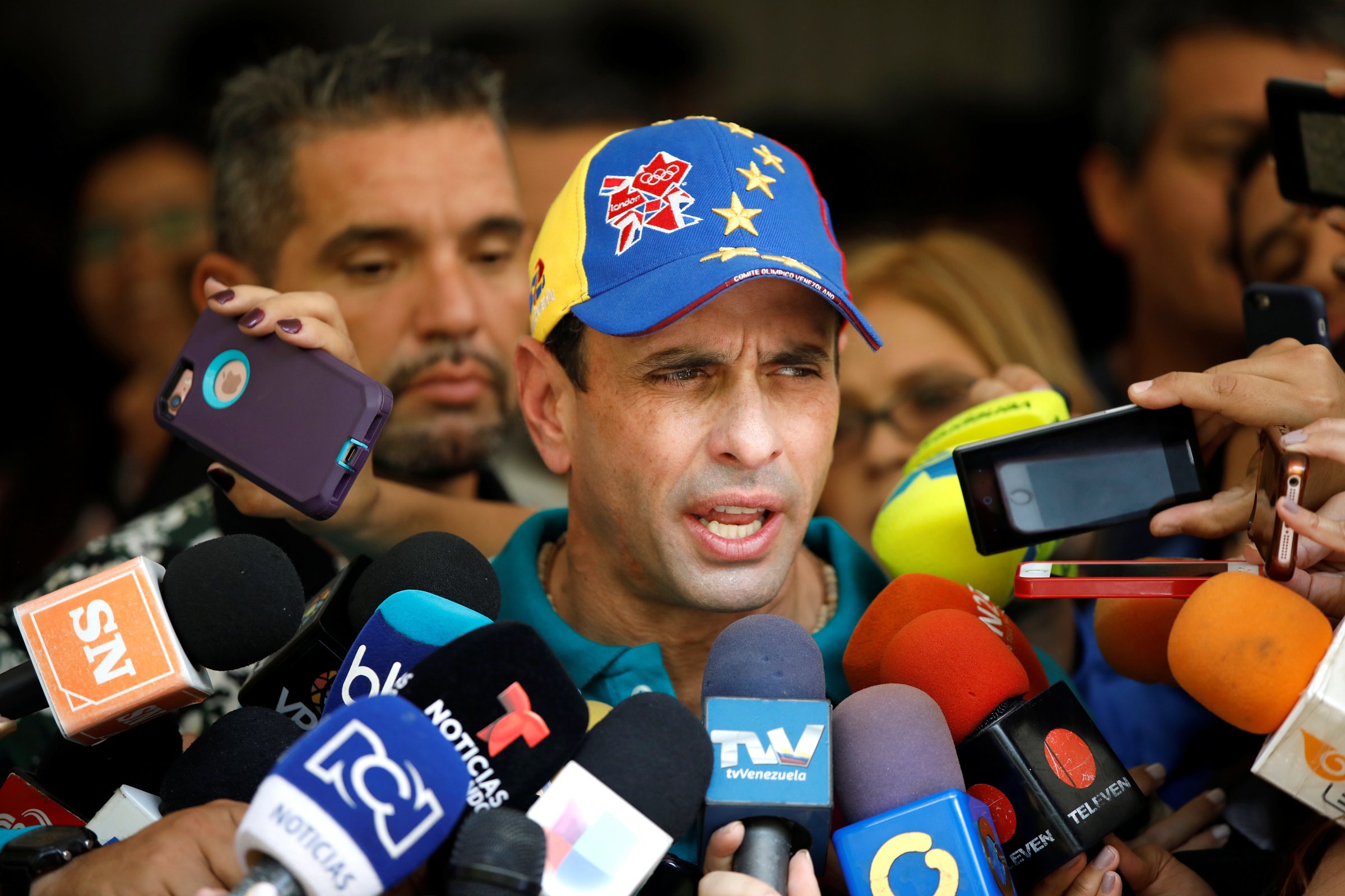 Venezuela's opposition leader Henrique Capriles speaks to the media after casting his vote during a nationwide elections for new governors in Caracas