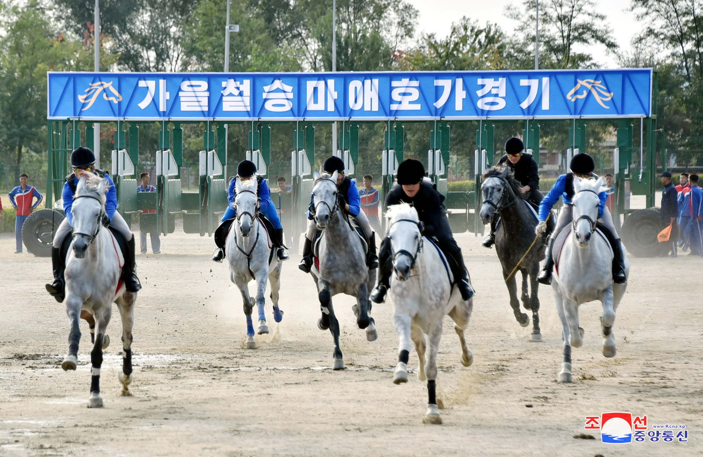 People take part in a horse riding game at the Mirim Equestrian Riding Club in Pyongyang
