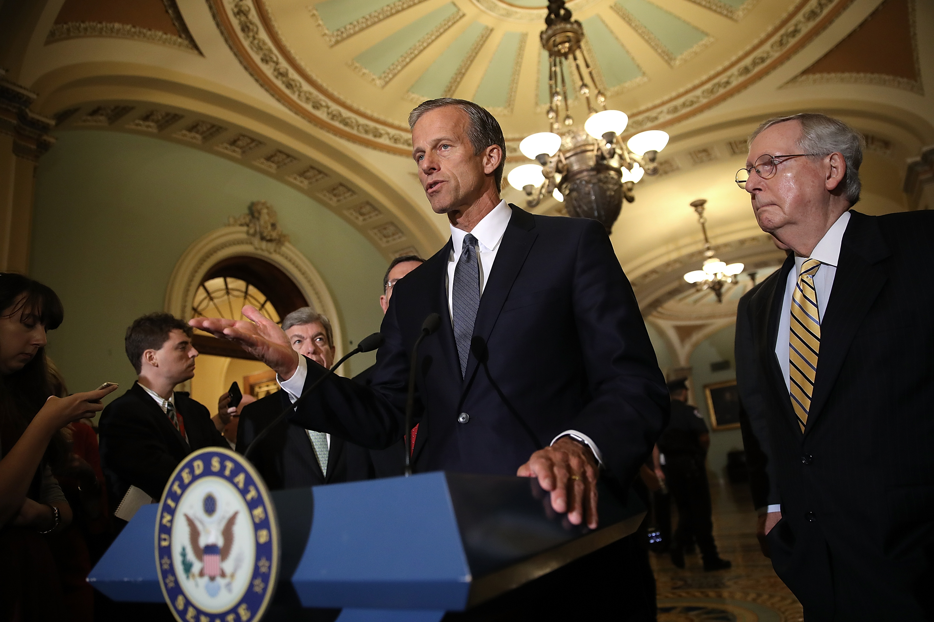 Sen. John Thune speaks with members of the Senate Republican leadership during a press conference at the U.S. Capitol on Sept. 12, 2017 in Washington, DC. During the press conference, Senate Majority Leader Mitch McConnell answered a range of questions relating to the upcoming Senate agenda. (Win McNamee—Getty Images)