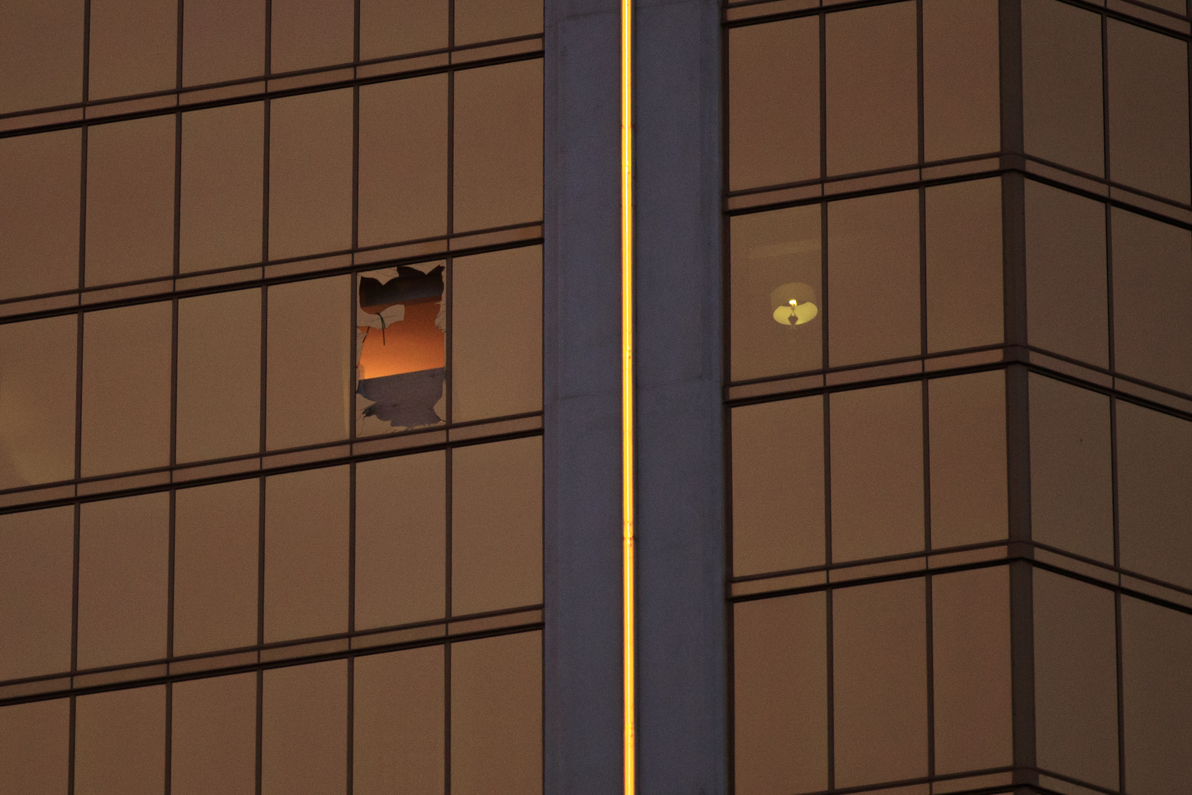 A window is broken on the 32nd floor of the Mandalay Bay Resort and Casino where a gunman opened fire on a concert crowd on Sunday night, Oct. 3, 2017 in Las Vegas. (Drew Angerer—Getty Images)