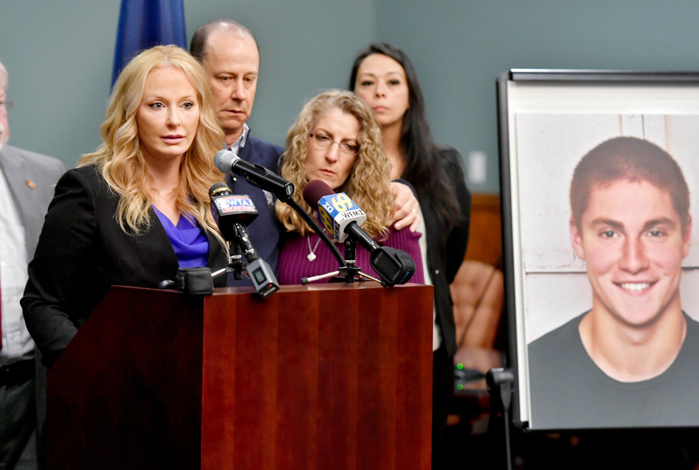 Centre County District Attorney Stacy Parks Miller, left, stands with Tim Piazza’s parents on May 5 to announce the results of an investigation into his death