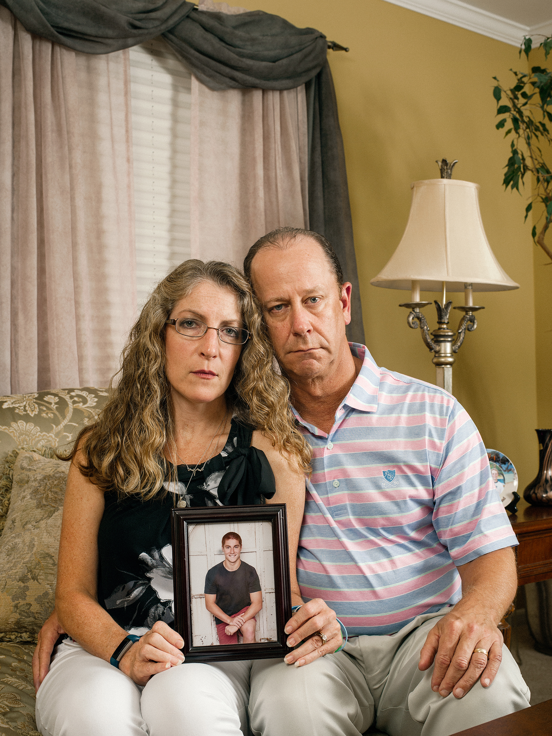 Evelyn and Jim Piazza with a photo of their son Tim, who died in February after a fraternity hazing ritual at Penn State University