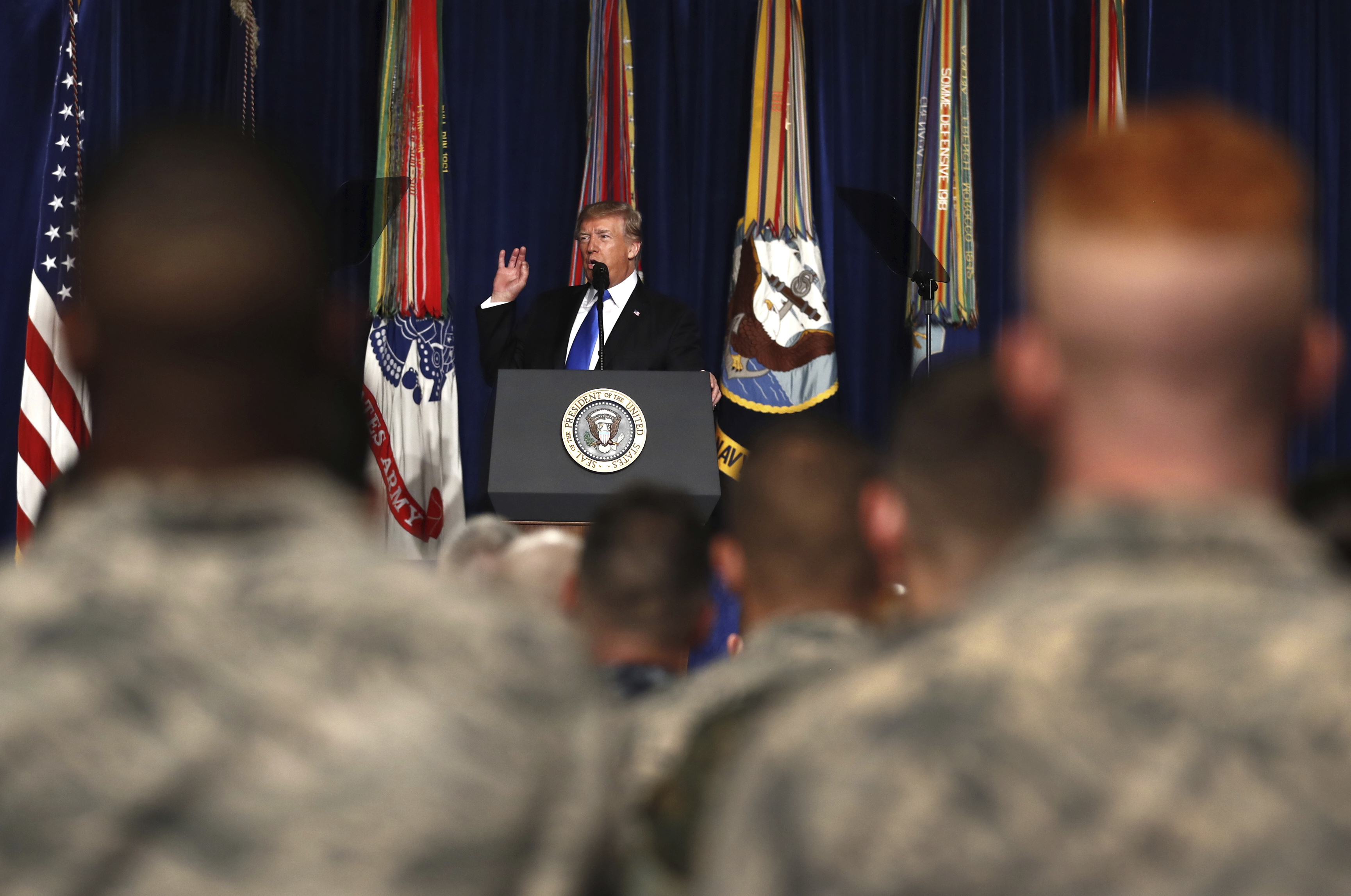 President Donald Trump speaks at Fort Myer in Arlington Va., about U.S. strategy in Afghanistan. (Carolyn Kaster—AP)