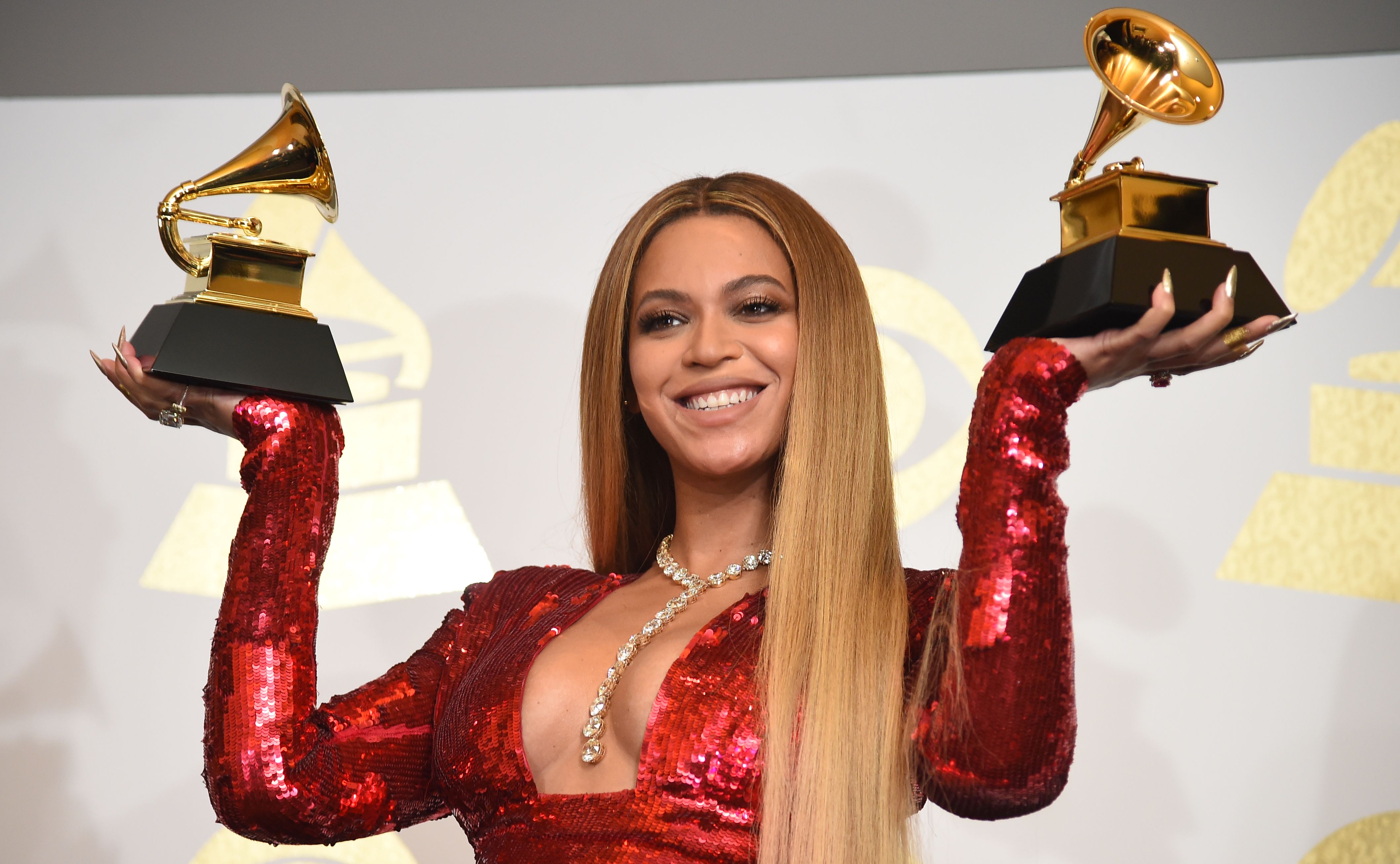 Singer Beyonce poses with her Grammy trophies in the press room during the 59th Annual Grammy music Awards on Feb. 12, 2017, in Los Angeles, Cali. (Robyn Beck—AFP/Getty Images)
