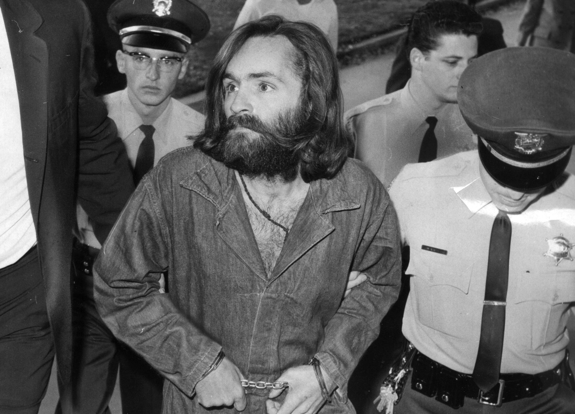 Charles Manson is escorted to court for preliminary hearing on December 3, 1969 in Los Angeles, California. (John Malmin&mdash;LA Times via Getty Images)