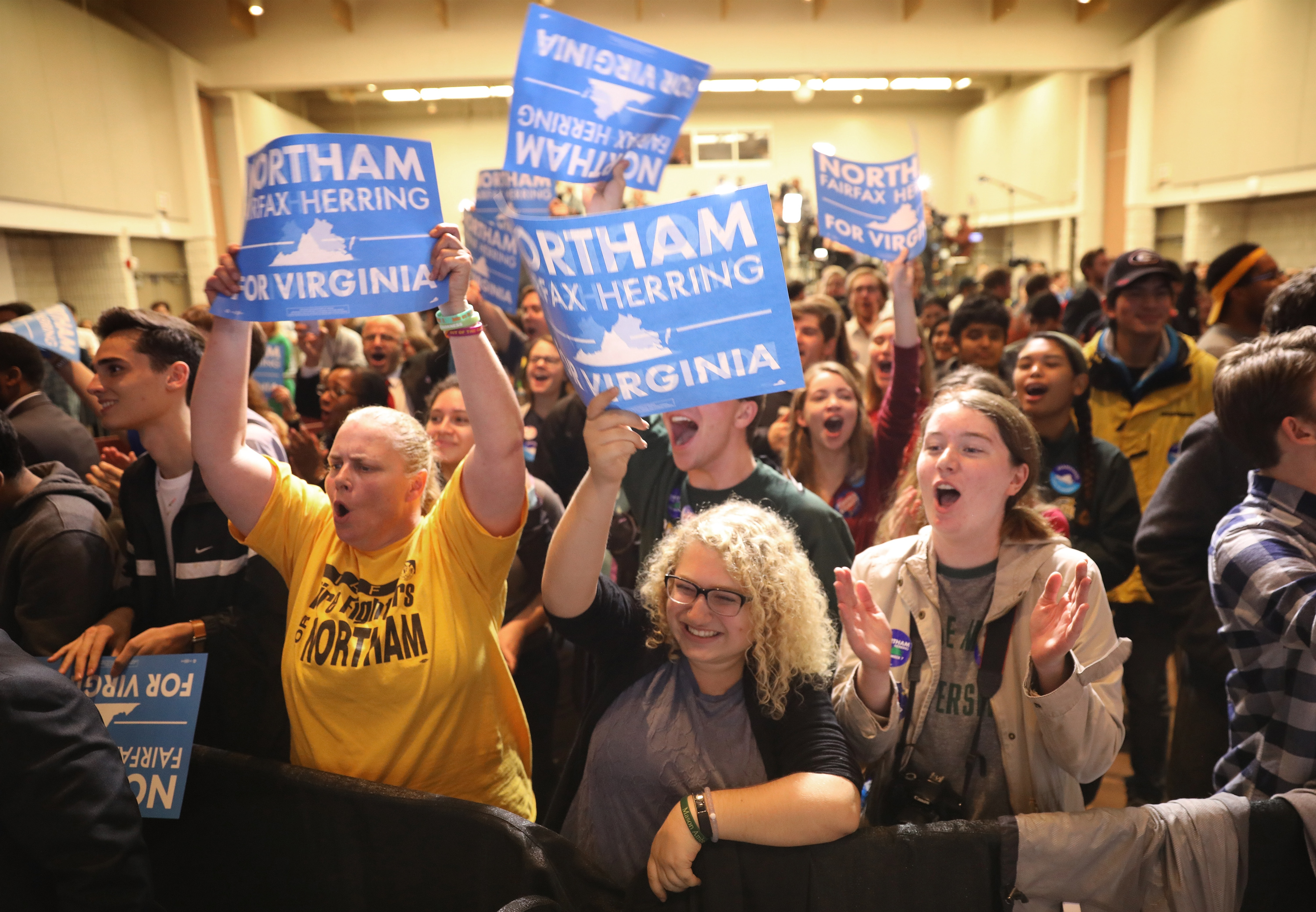 FAIRFAX, VA - NOVEMBER 07:  Supporters of Ralph Northam, the Democratic candidate for governor of Virginia, celebrate as early projections indicated a Northam victory at an election night rally November 7, 2017 in Fairfax, Virginia. Northam has fought a close race with Republican candidate Ed Gillespie.  (Photo by Win McNamee/Getty Images) (Win McNamee—Getty Images)