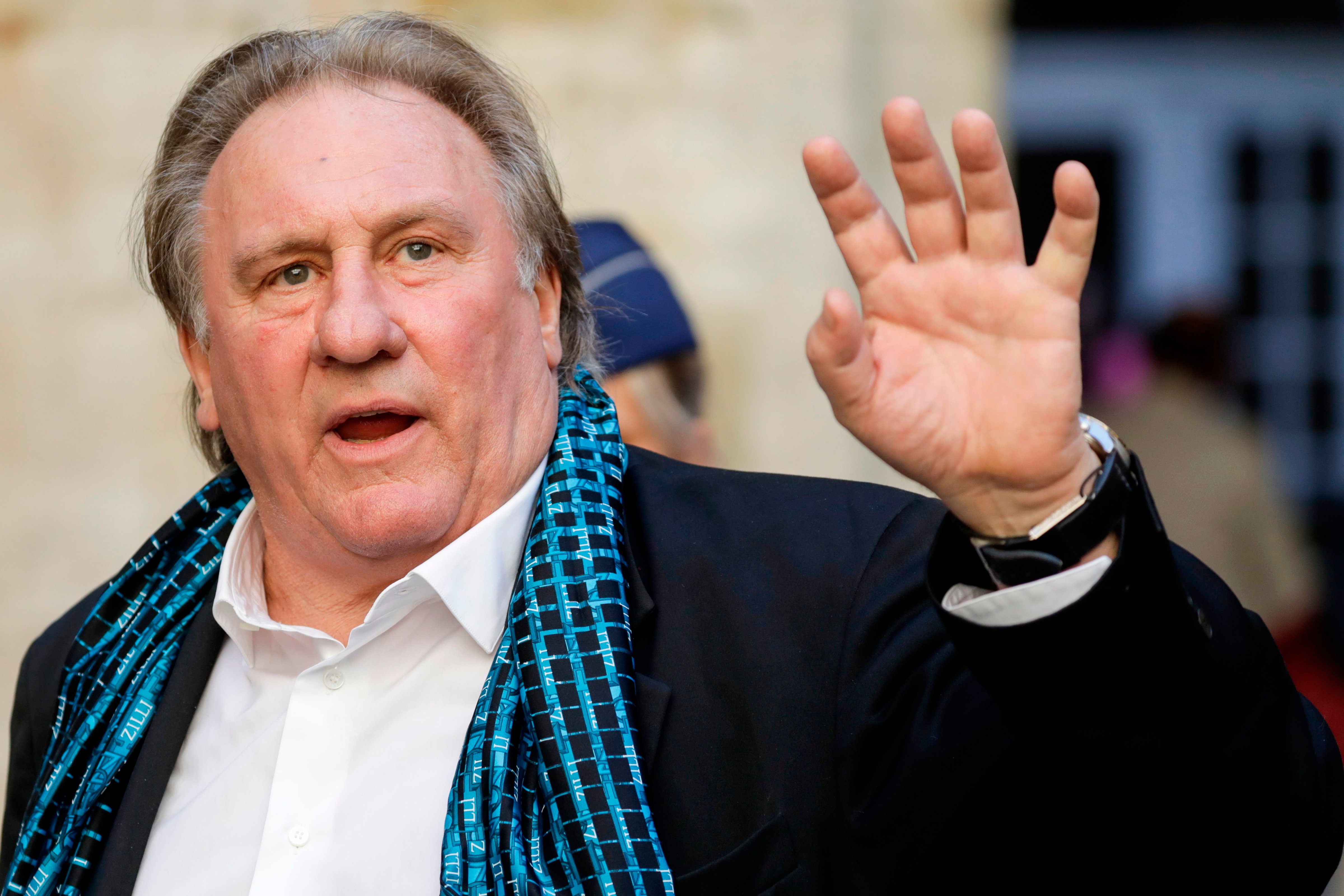 (FILES) In this file photo taken on June 25, 2018, French actor Gerard Depardieu waves as he arrives at the Town Hall in Brussels for a ceremony as part of the 'Brussels International Film Festival' (Photo by THIERRY ROGE / BELGA / AFP) / Belgium OUT (Photo credit should read THIERRY ROGE/AFP/Getty Images) (THIERRY ROGE—AFP/Getty Images)