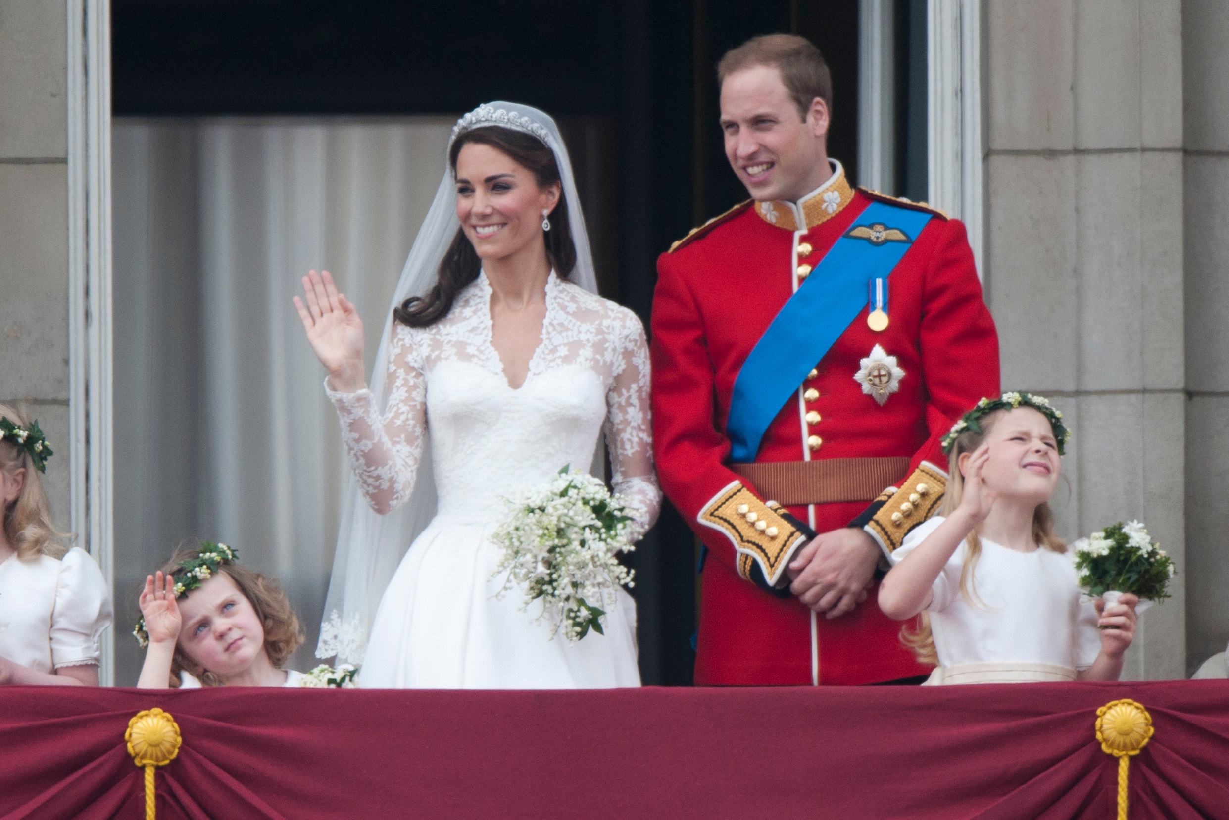 Catherine, Duchess of Cambridge and Prince William, Duke of Cambridge on the balcony at Buckingham Palace with Bridesmaids Margarita Armstrong-Jones (Right) And Grace Van Cutsem (Left), following their wedding at Westminster Abbey on April 29, 2011 in London, England. (Photo by Mark Cuthbert—UK Press/Getty)