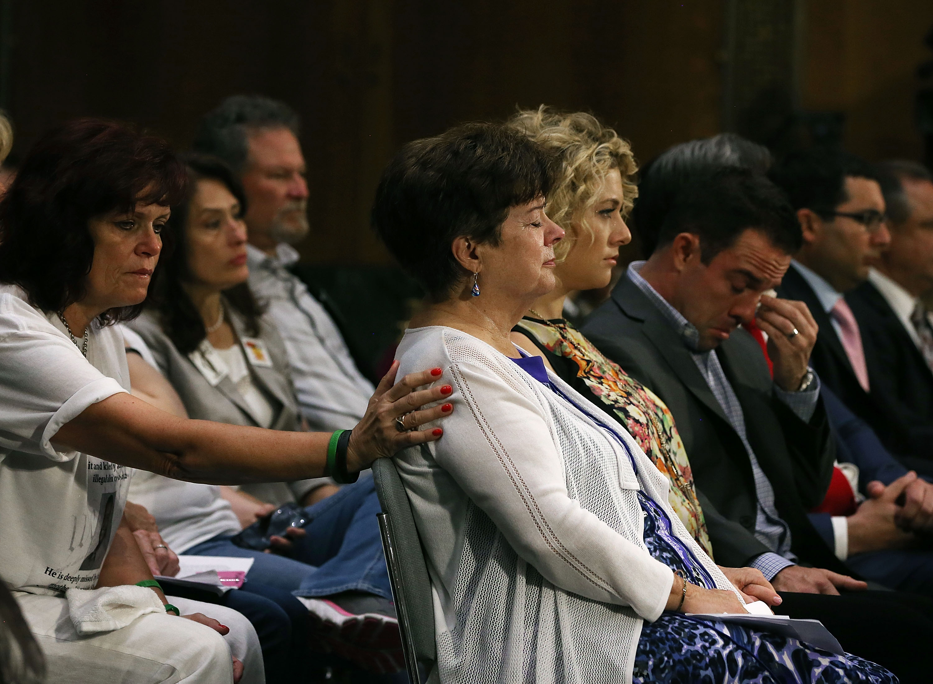 Liz Sullivan (C) mother of Kathryn "Kate" Steinle who was killed by an illegal immigrant in San Francisco, is comforted while her son Brad Steinle (R) sits nearby during a Senate Judiciary Committee hearing on Capitol Hill, July 21, 2015 in Washington, DC. The committee heard testimony from family members who have had loved ones killed by illegal immigrants. (Mark Wilson&mdash;Getty Images)
