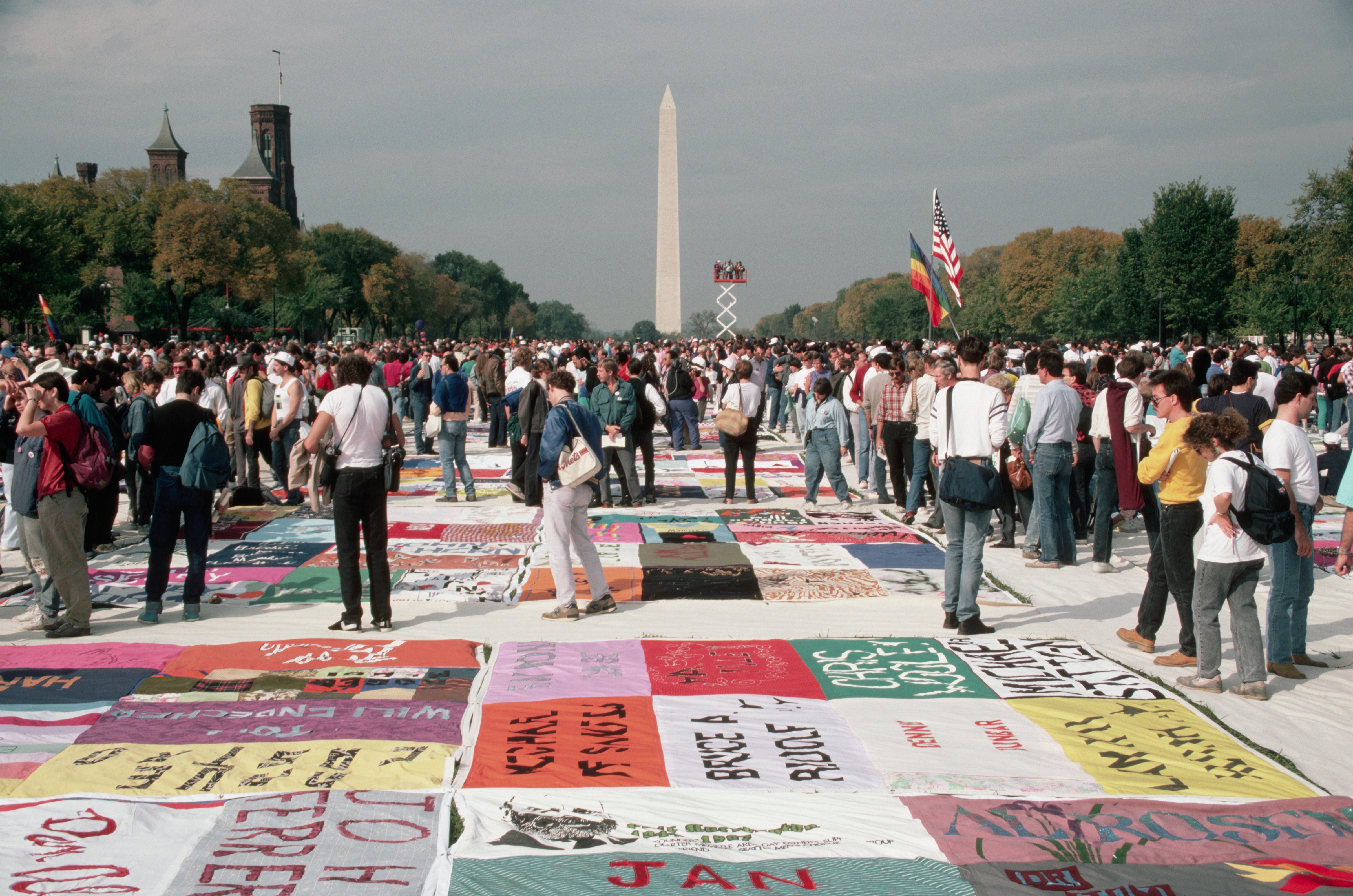 People Looking at the AIDS Quilt