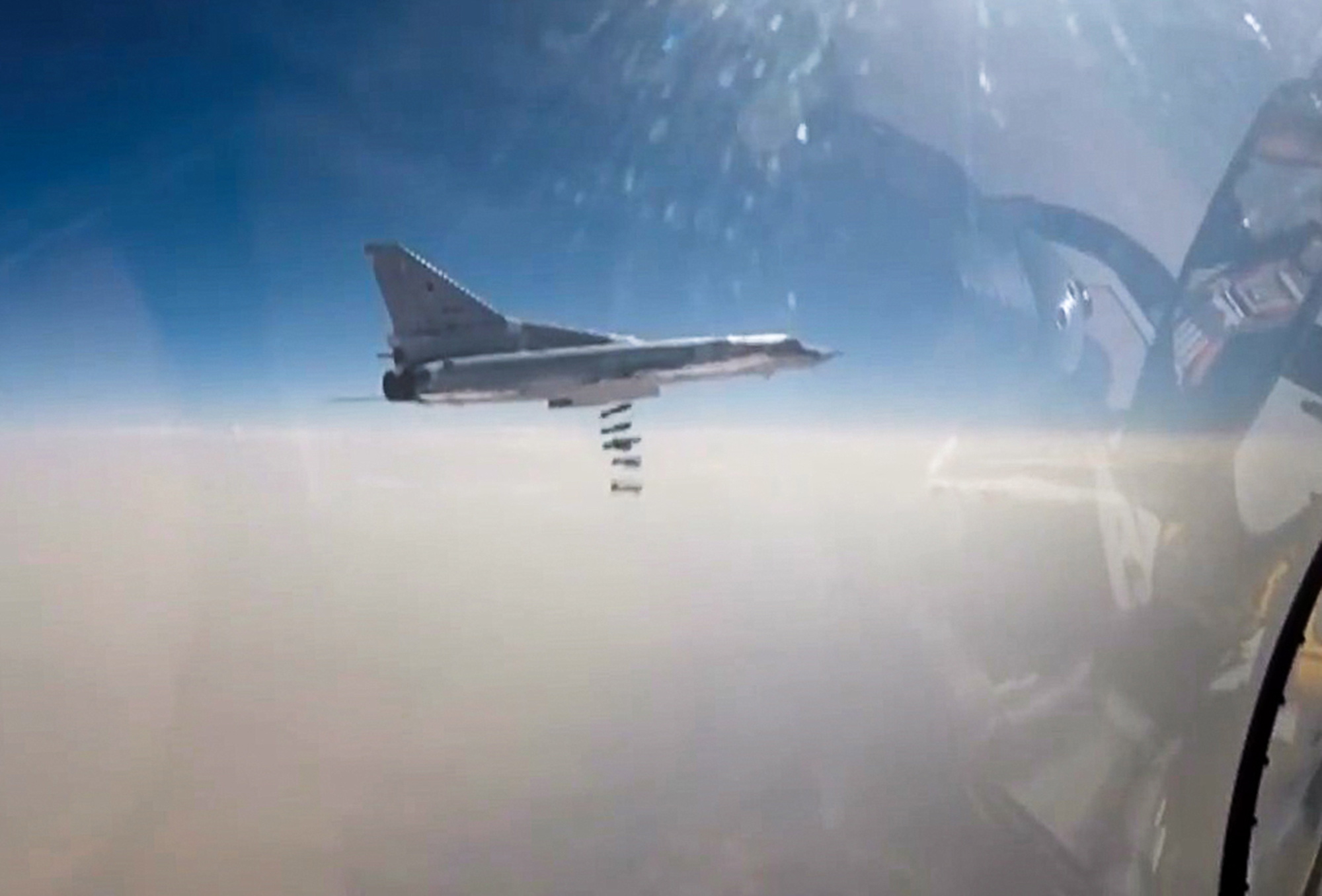 Pictured in this screen grab is a Russian Tupolev Tu-22M3 strike bomber on a bombing mission against terrorist targets in Deir ez-Zor Province. (Russian Defence Ministry Press Office—TASS/Getty Images)