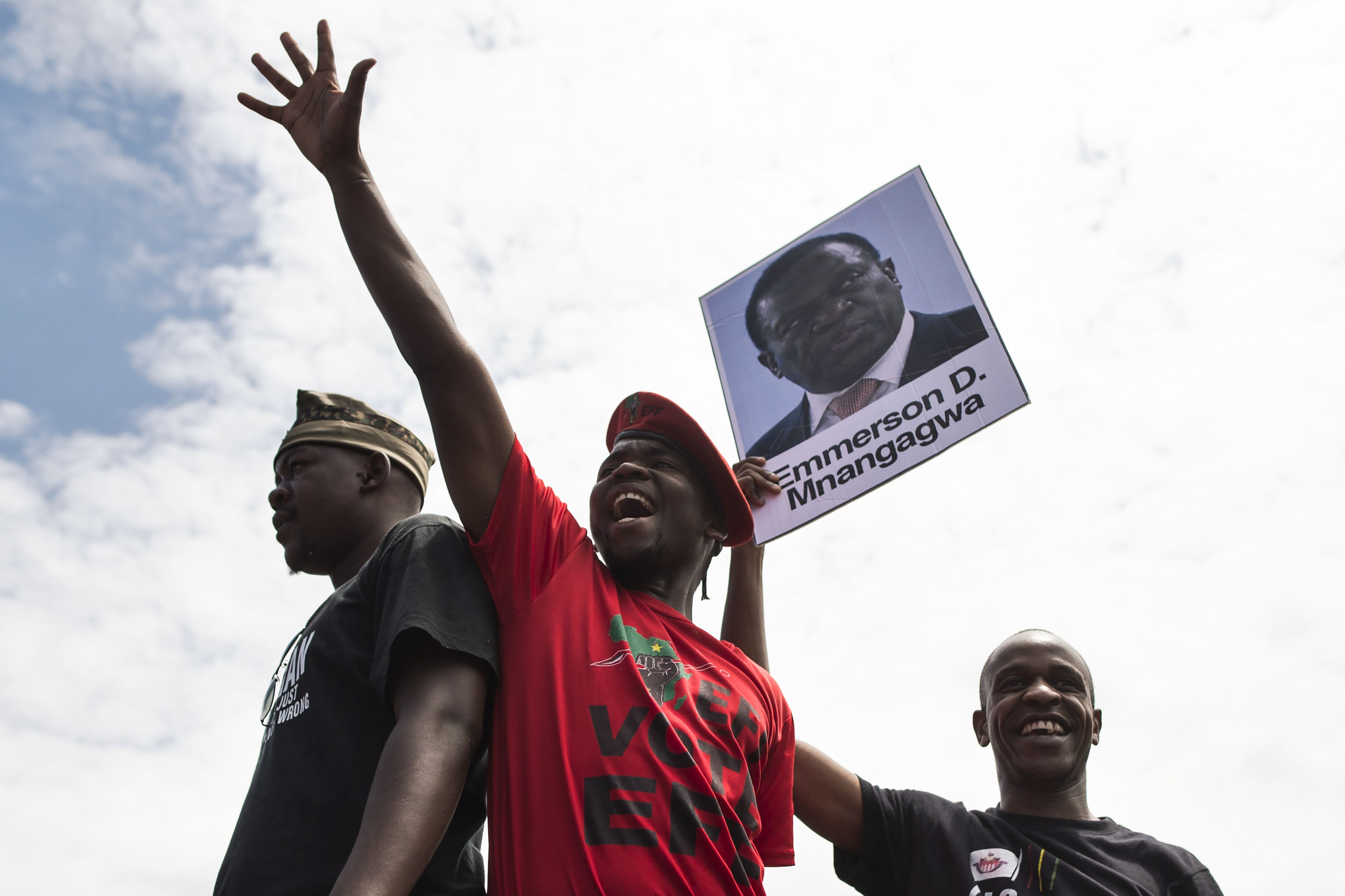 University of Zimbabwe students, holding a portrait of former vice president Emmerson Mnangagwa, take part in a demonstration on Nov. 20, 2017 in Harare, to demand the withdrawal of Grace Mugabe's doctorate (AFP/Getty Images)