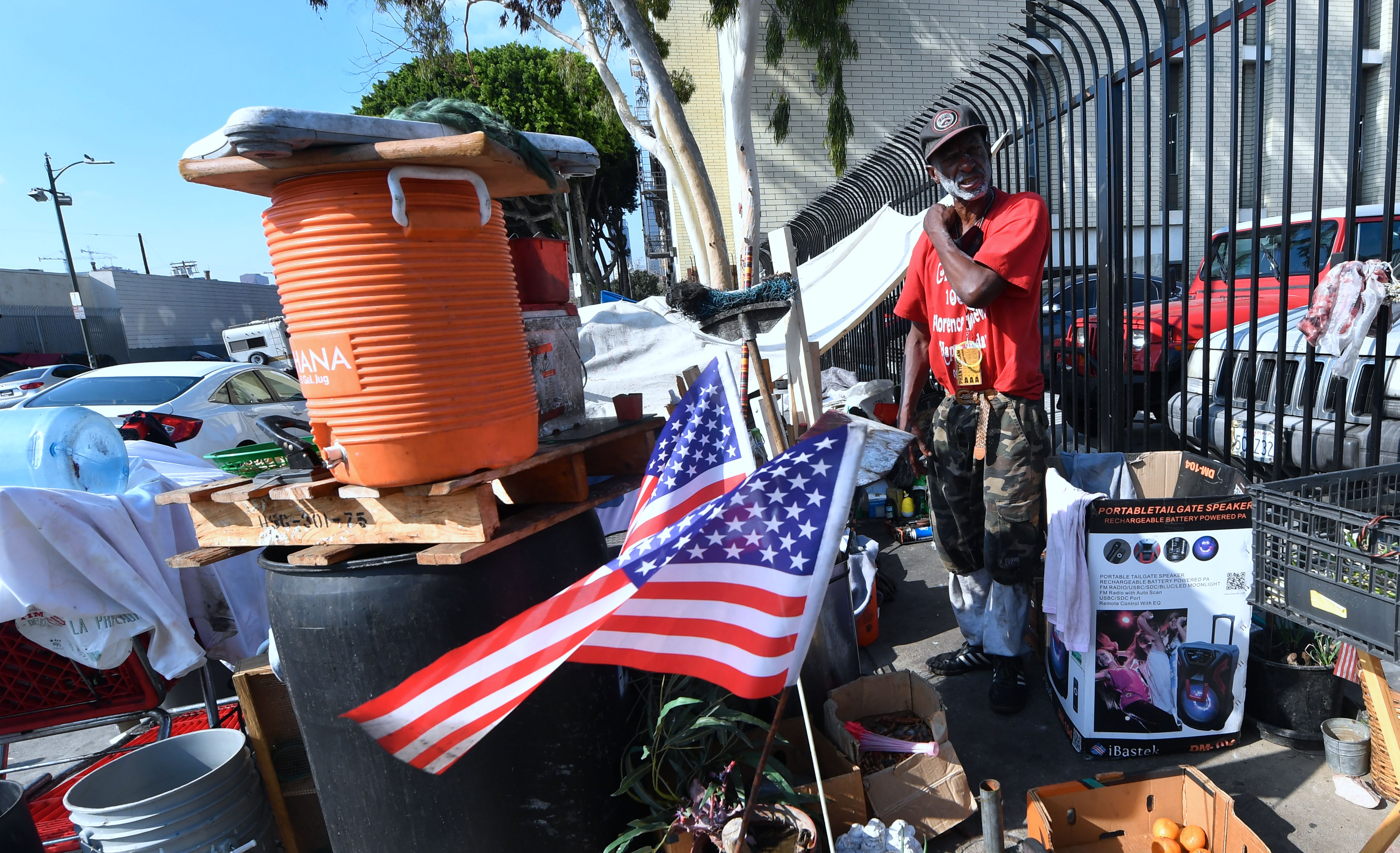 Flags are hoisted at the street corner encampment of homeless veteran Kendrick Bailey on November 10, 2017 in Los Angeles, California, one of the nation's largest homeless populations which saw a 57 percent increase in the number of homeless vets living on Los Angeles streets from last year.  
                      Bailey, who says he served in Vietnam, said he has been living on the streets since at least as long as Obama became president. Veterans Day, an official United States public holiday, is observed annually on November 11th.  / AFP PHOTO / FREDERIC J. BROWN        (Photo credit should read FREDERIC J. BROWN/AFP/Getty Images) (FREDERIC J. BROWN&mdash;AFP/Getty Images)