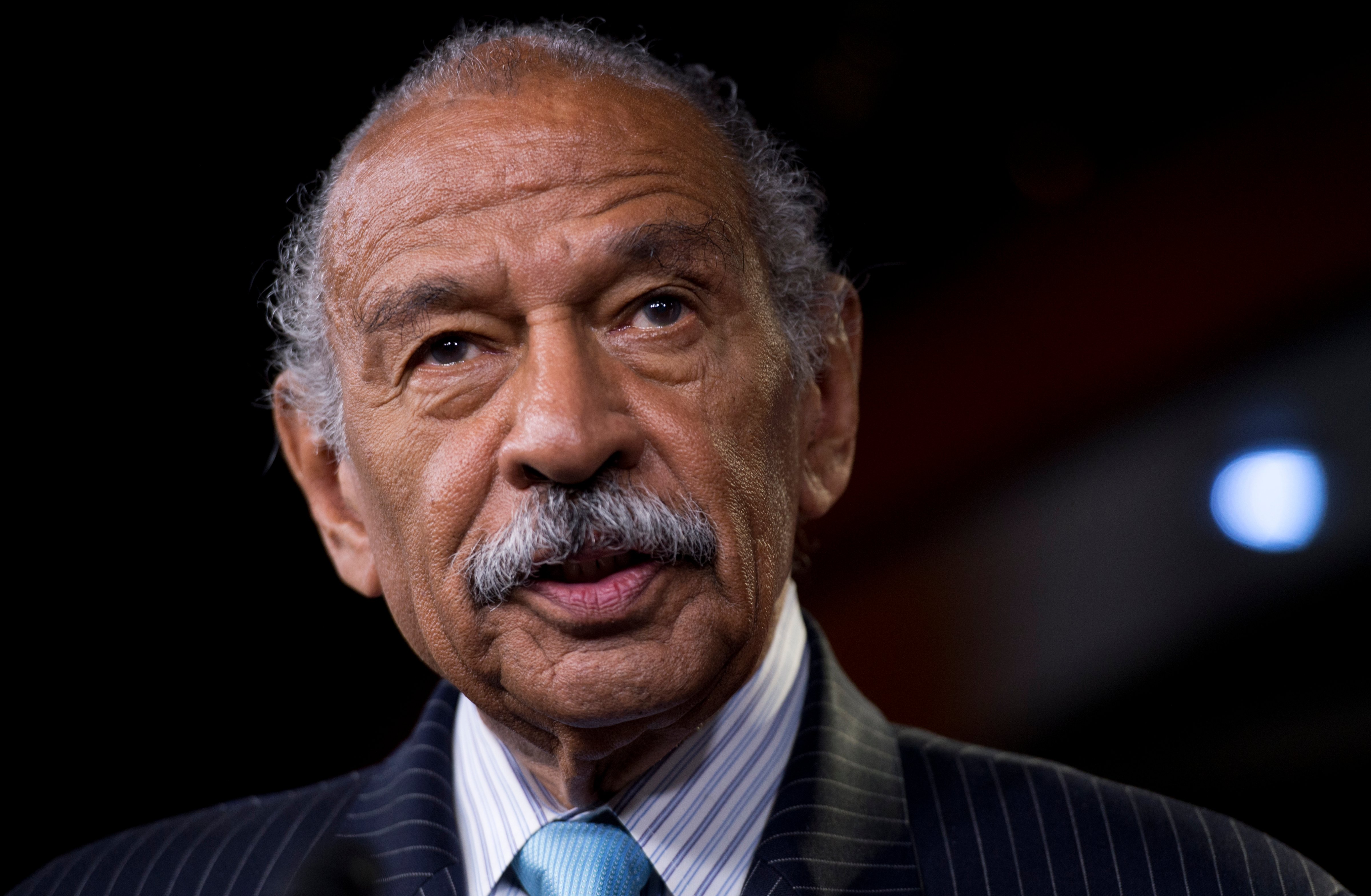 Rep. John Conyers, D-Mich., speaks during a Congressional Progressive Caucus news conference in the Capitol Visitor Center to introduce the Deal for All resolution. (Tom Williams—CQ-Roll Call/Getty Images)
