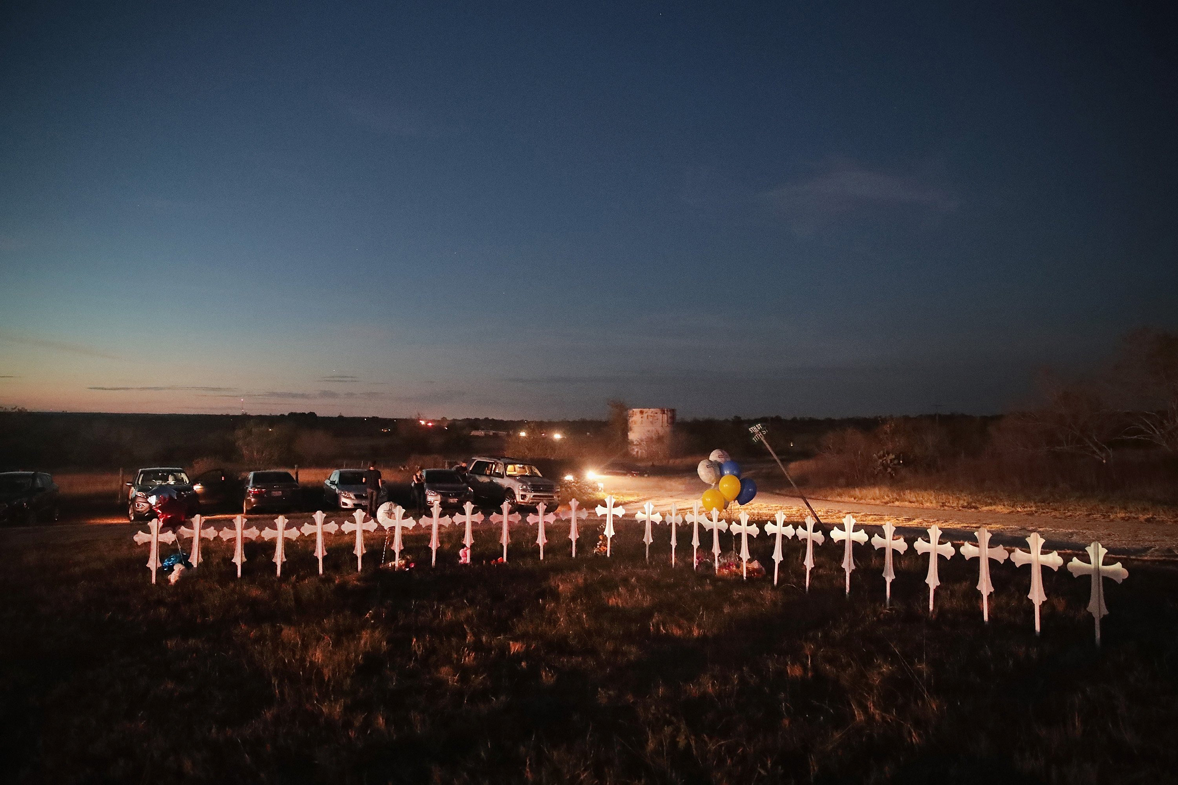 Twenty-six crosses, one for each of the dead, stand in a field on the edge of town on Nov. 6 (Scott Olson—Getty Images)