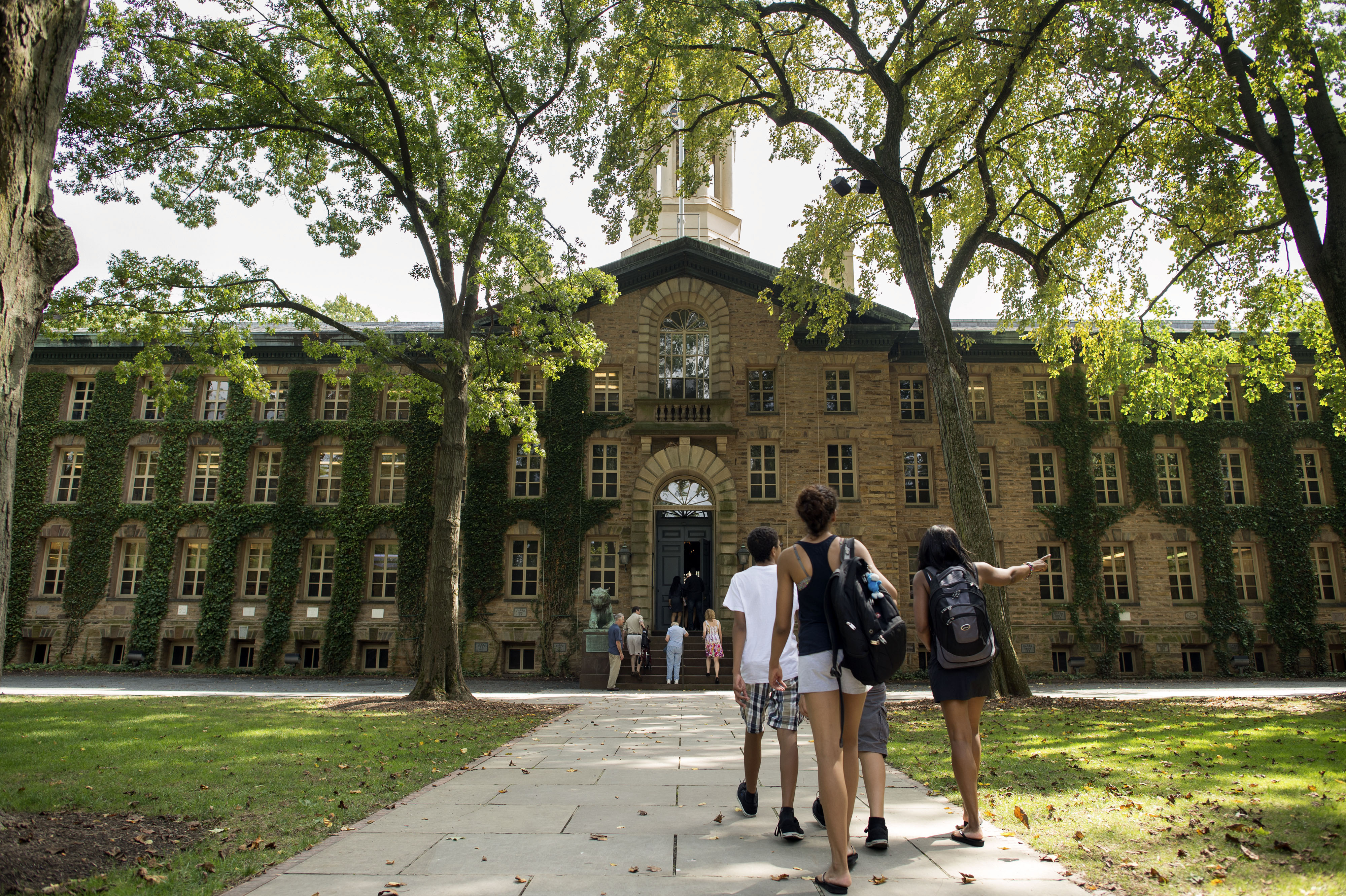 People walk on the Princeton University campus in Princeton, N.J., on Aug. 30, 2013. (Craig Warga—Bloomberg/Getty Images)