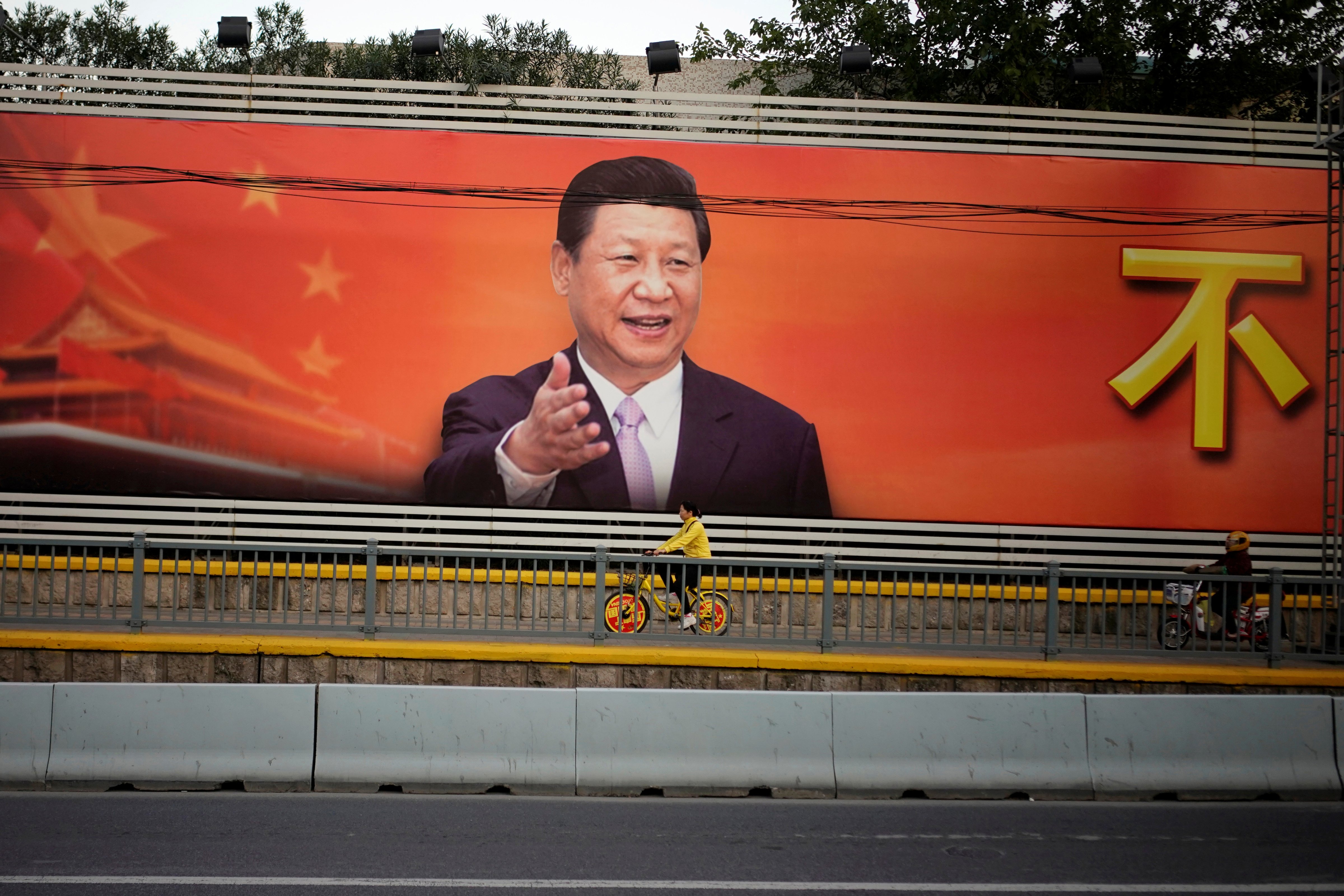 A poster with a portrait of Chinese President Xi Jinping is displayed along a street in Shanghai, China, October 24, 2017. (Aly Song—Reuters)