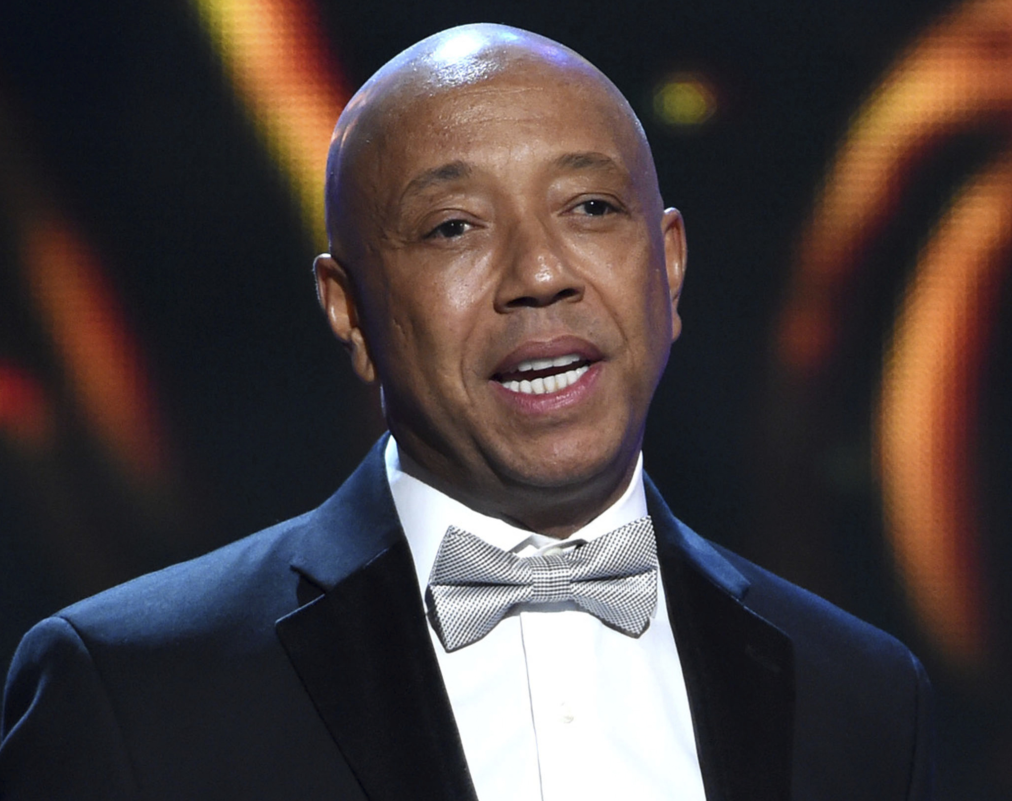 Russell Simmons presents the Vanguard Award on stage at the 46th NAACP Image Awards in Pasadena, Calif. on Feb. 6, 2015 (Chris Pizzello—Invision/AP)