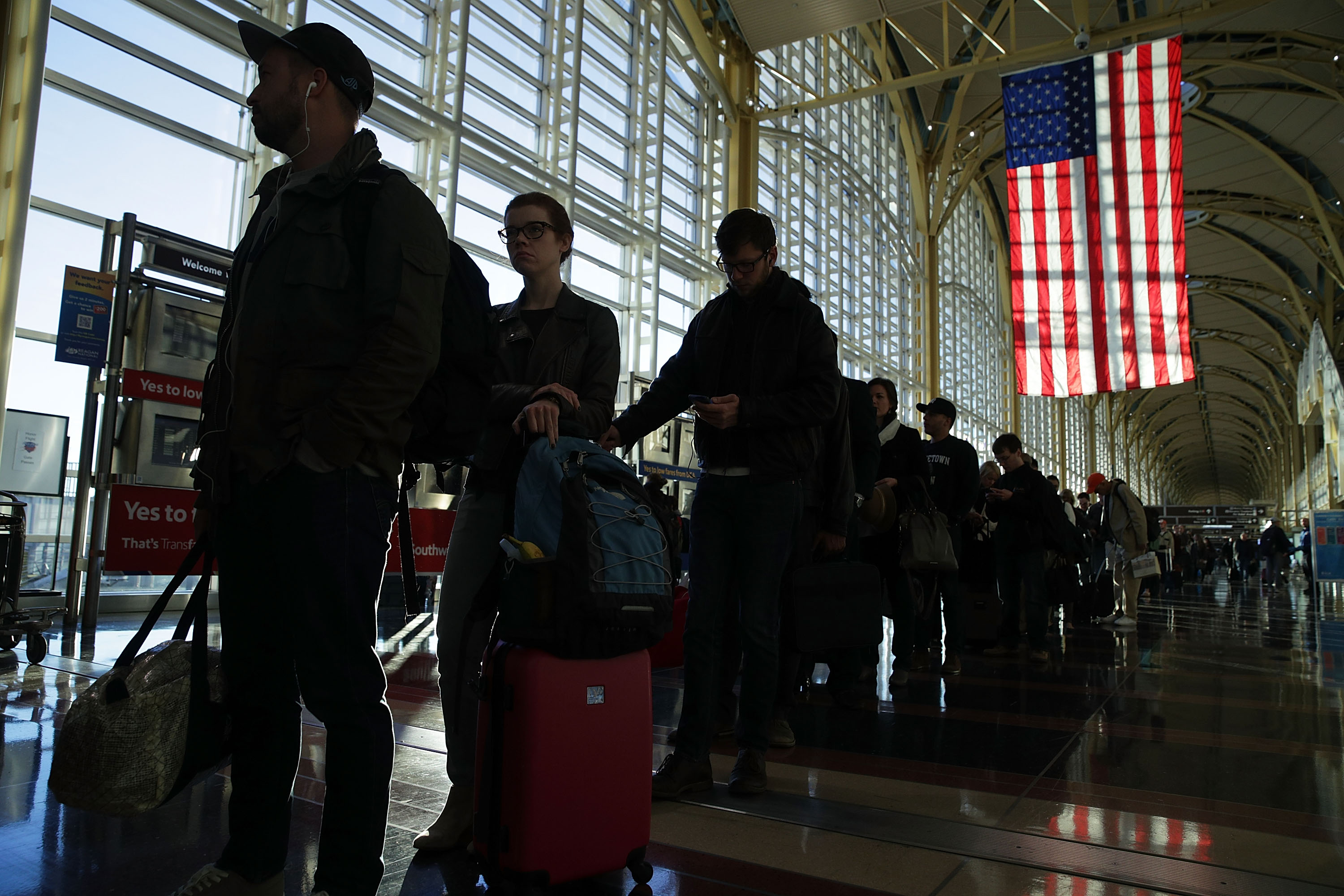 Travelers wait in-line for entering security check at Ronald Reagan Washington National Airport November 23, 2016 in Arlington, Virginia. AAA has predicted that it will be more crowded than usual to travel this Thanksgiving with nearly 49 million Americans driving or flying to their destinations (Alex Wong&mdash;Getty Images)