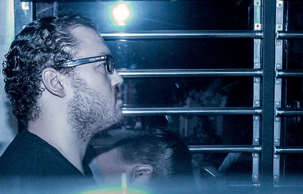 British banker Rurik Jutting accused of the murders of two Indonesian women, sits in a prison van as he arrives at the eastern court in Hong Kong on May 8, 2015. (Anthony Wallace/AFP—Getty Images)